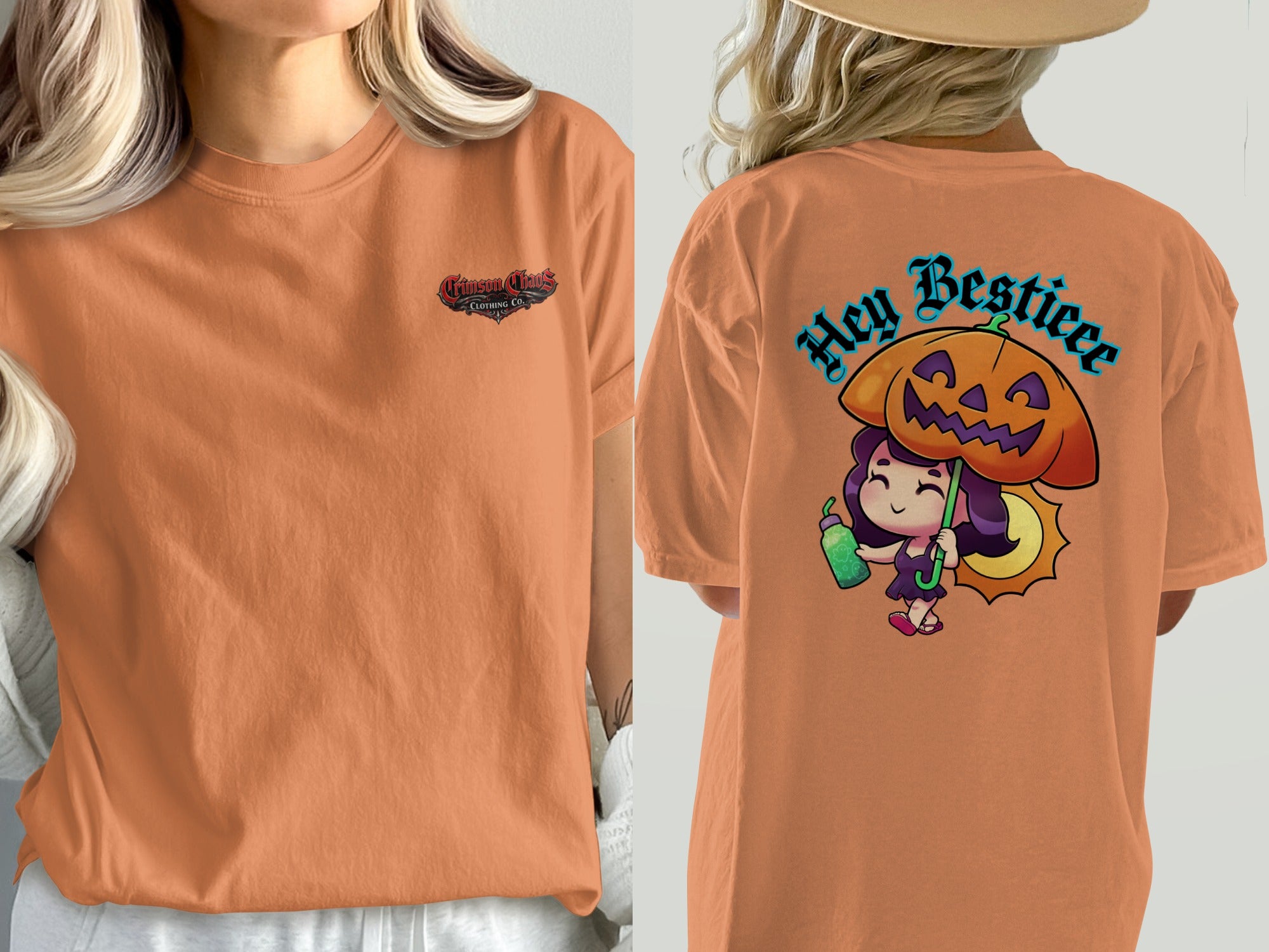 Orange t-shirt with "Crimson Chaos Clothing Co." logo and a cute witch with a pumpkin umbrella.