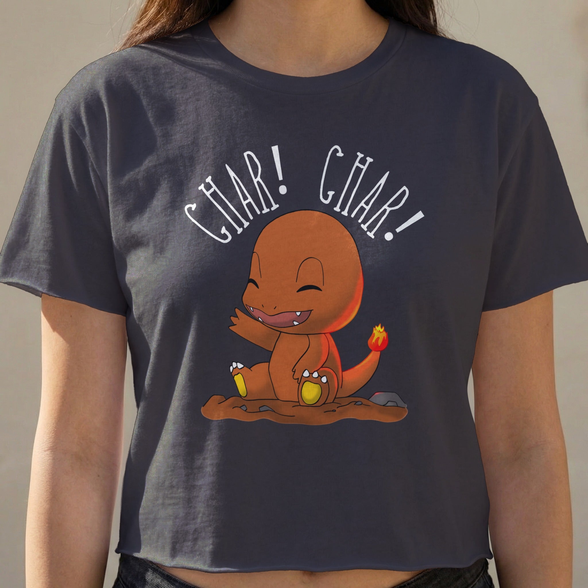 Charmander character from Pokémon on a dark gray t-shirt.