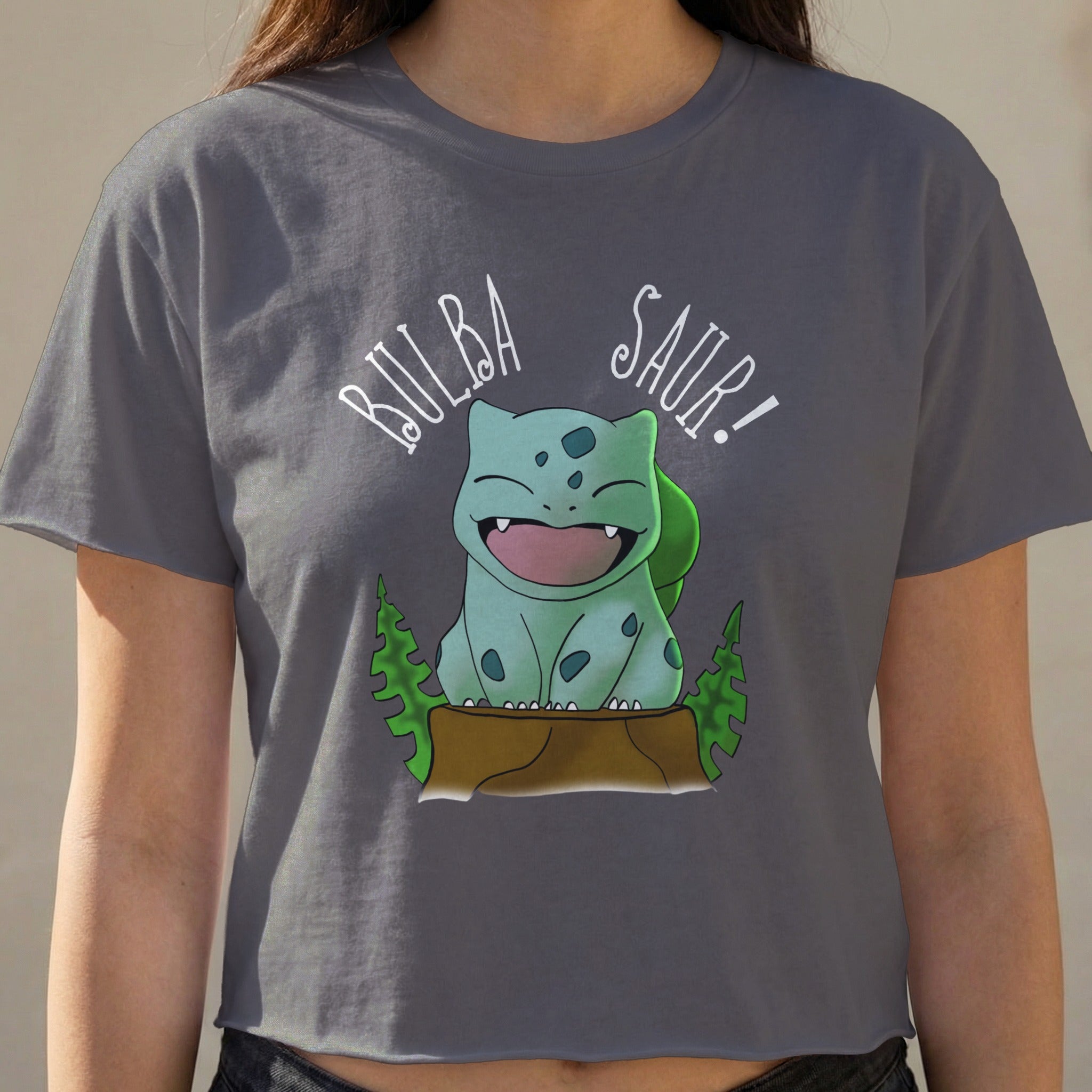 Bulbasaur graphic on a grey cropped t-shirt with "Bulba Saur!" text.