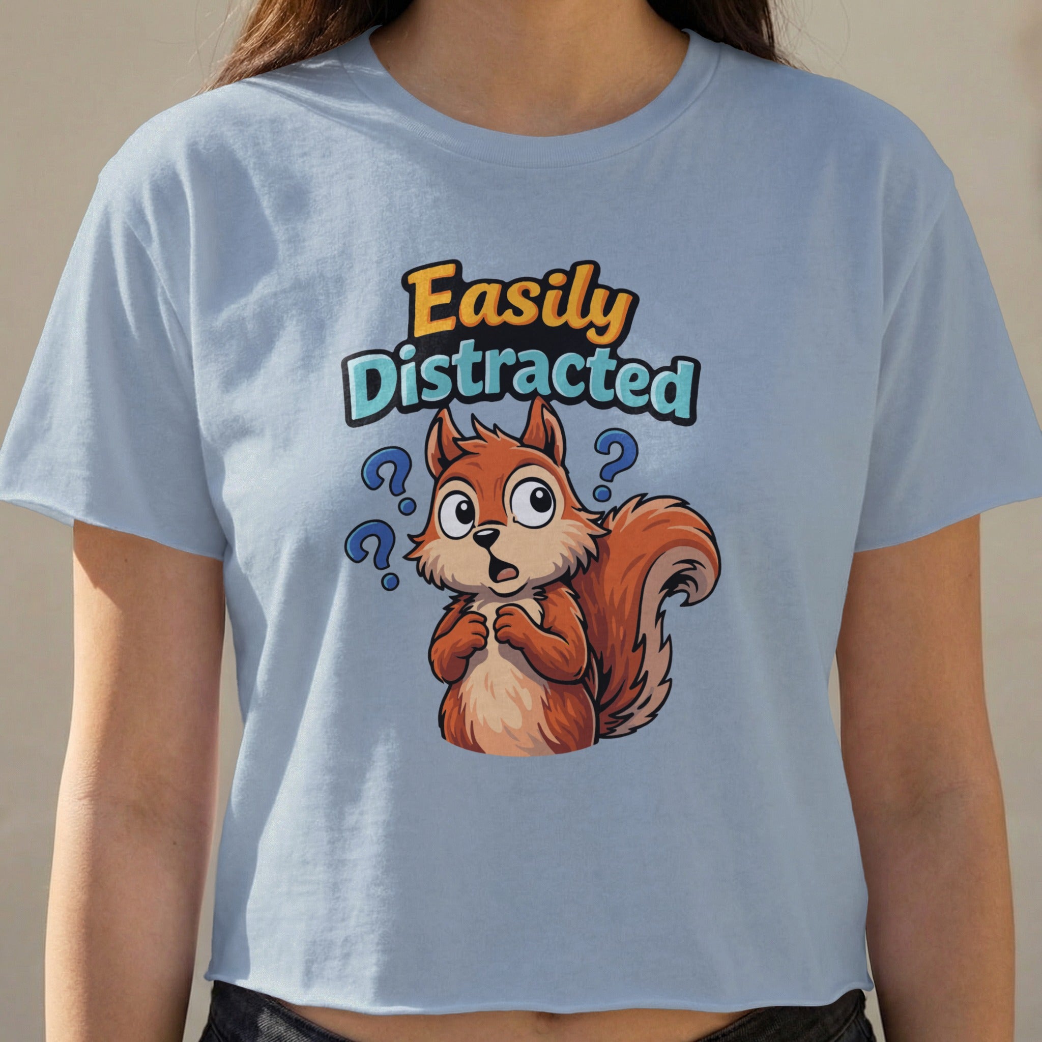 Squirrel wearing a t-shirt with "Easily Distracted" text.