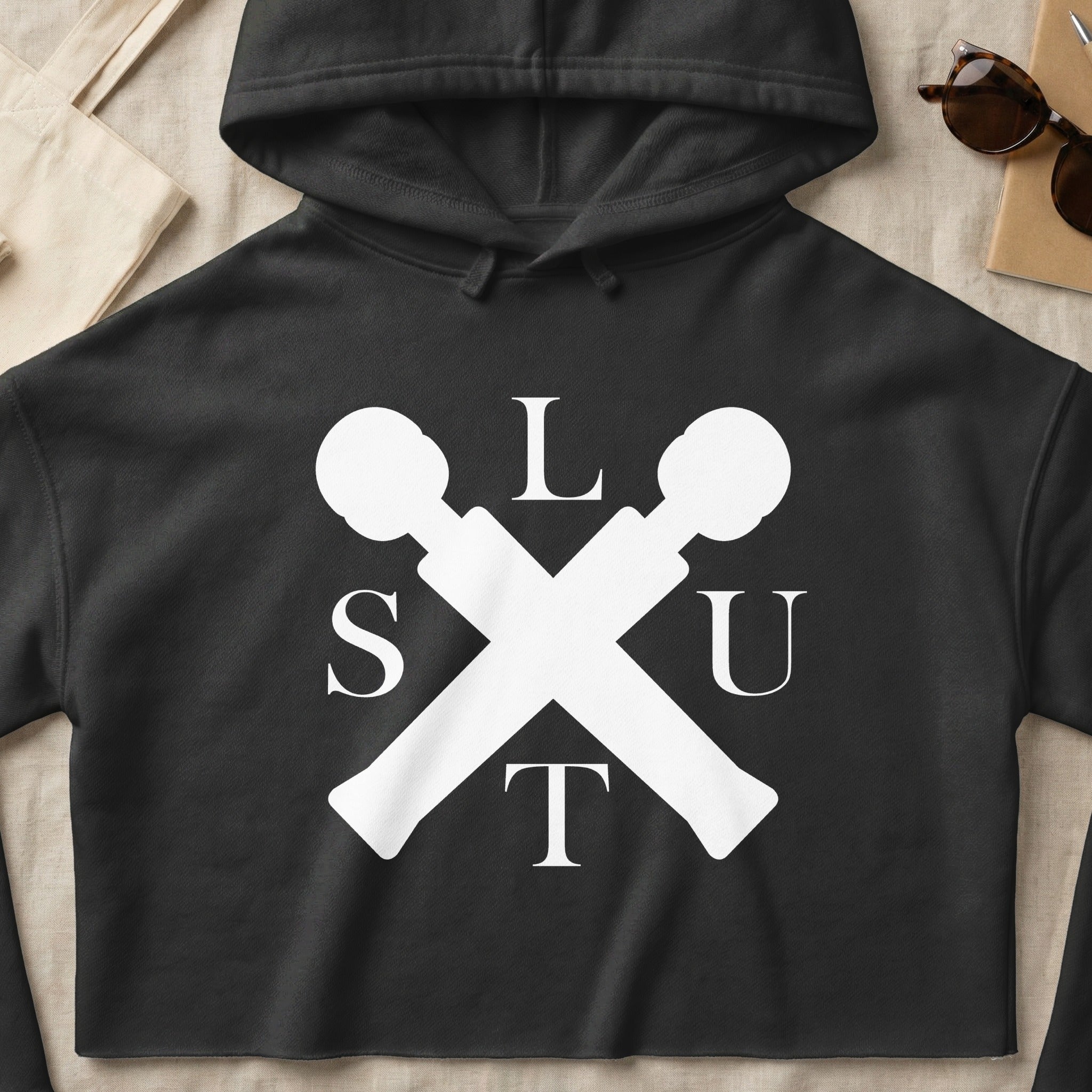 Black crop hoodie with white "SLUT" logo crossed microphones.
