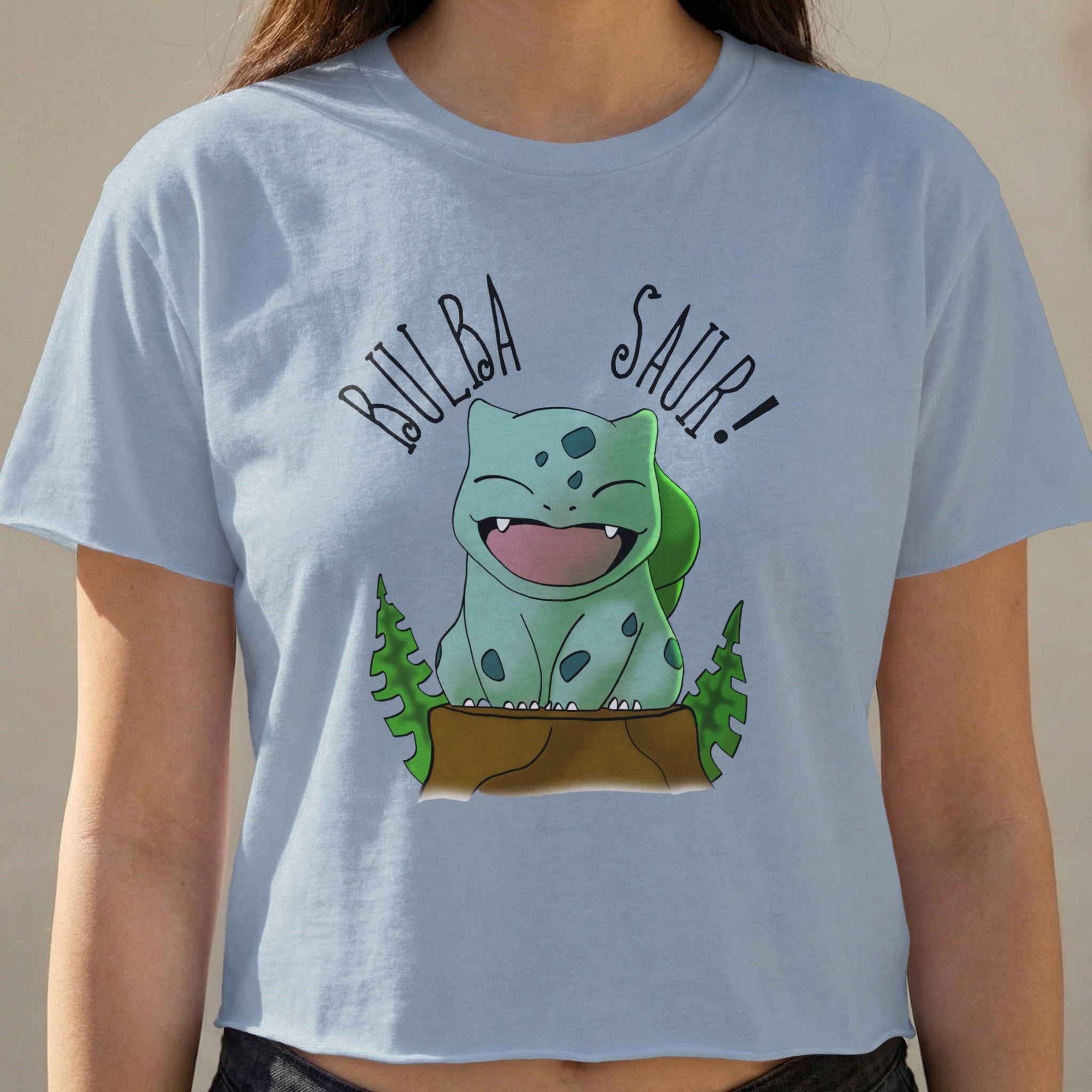Bulbasaur saying "Bulba Saur!" on a light blue crop top.