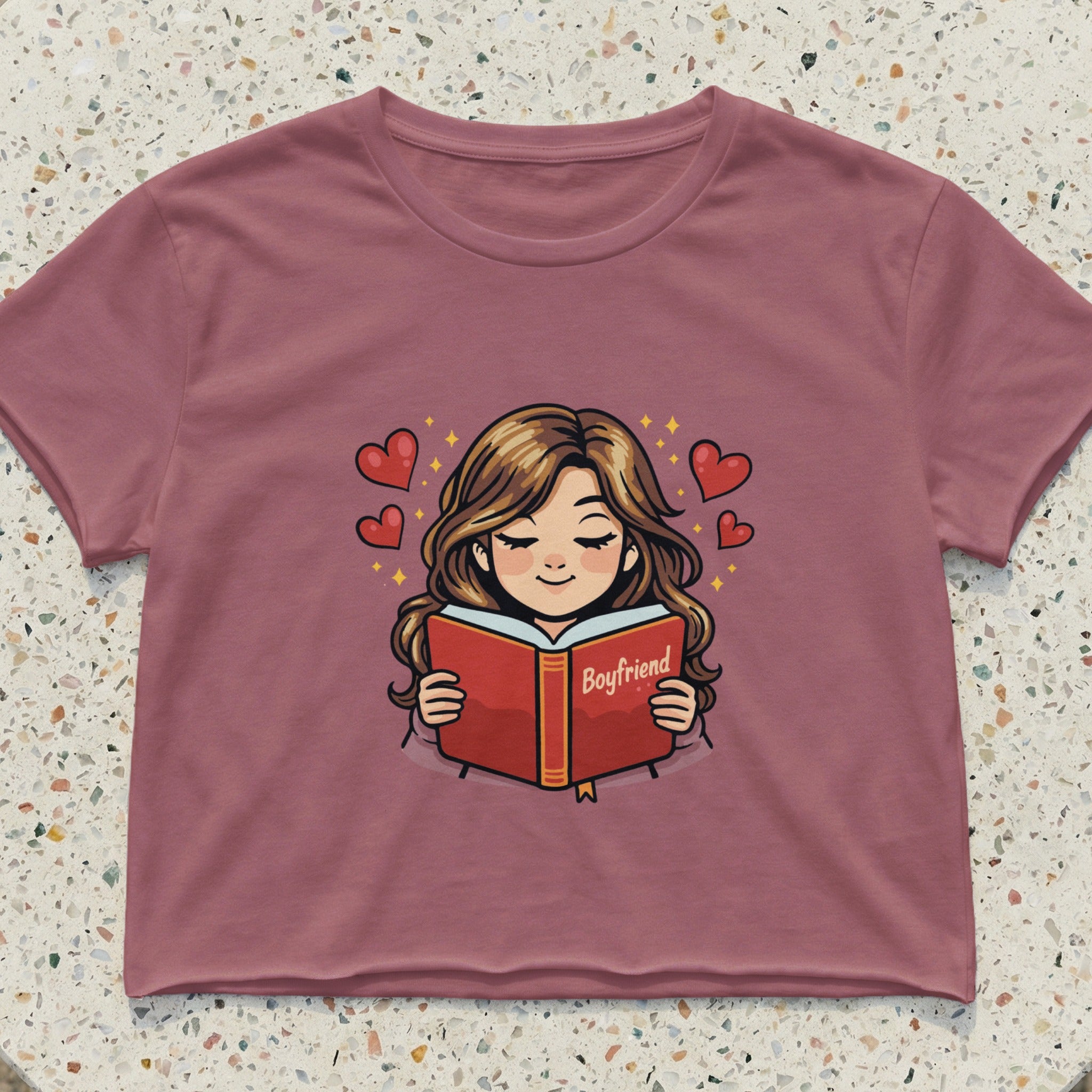 Crop top with illustration of a girl reading a book with "Boyfriend" on the cover.