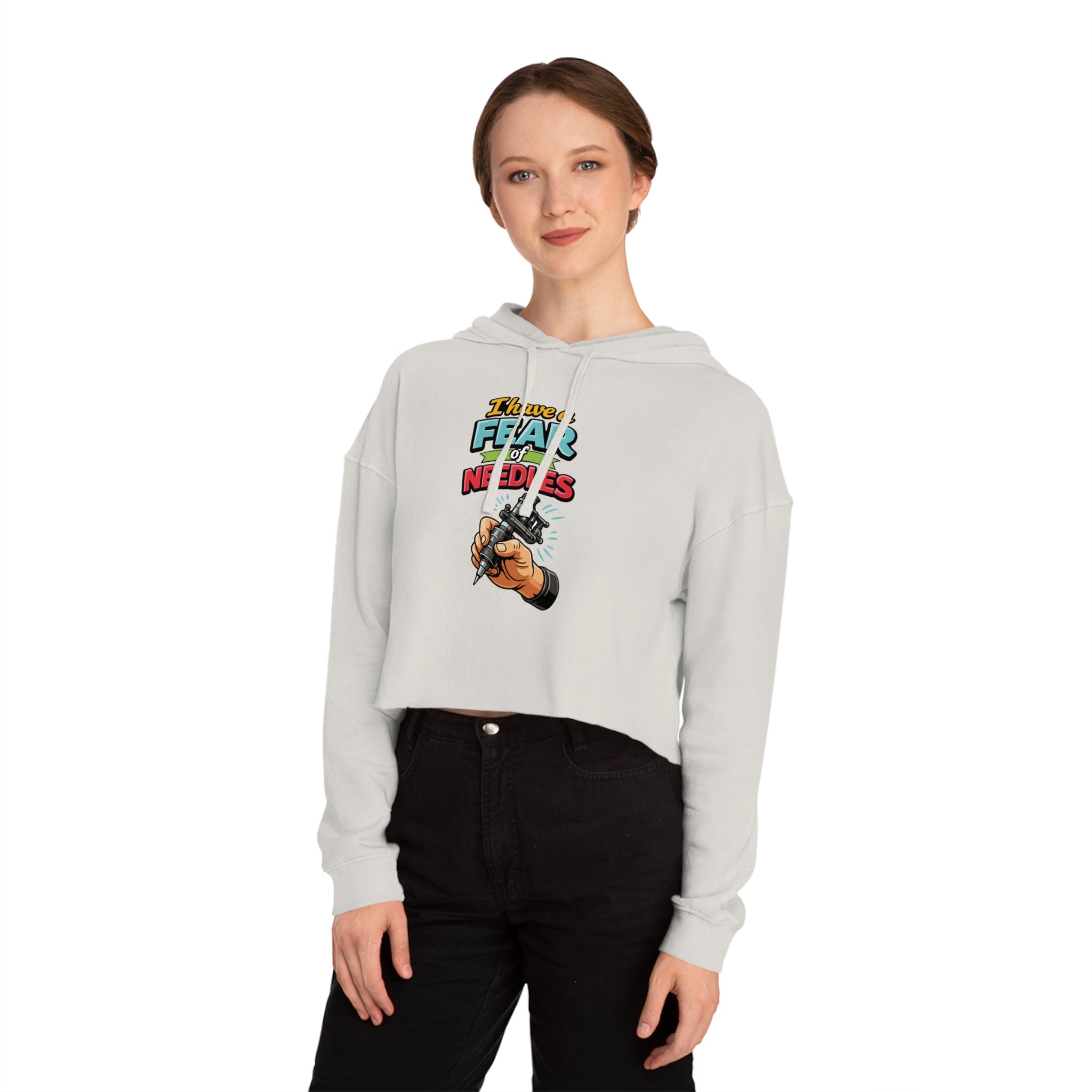 Cropped hoodie with cartoon hand holding tattoo gun and text "Don't fear the needles".