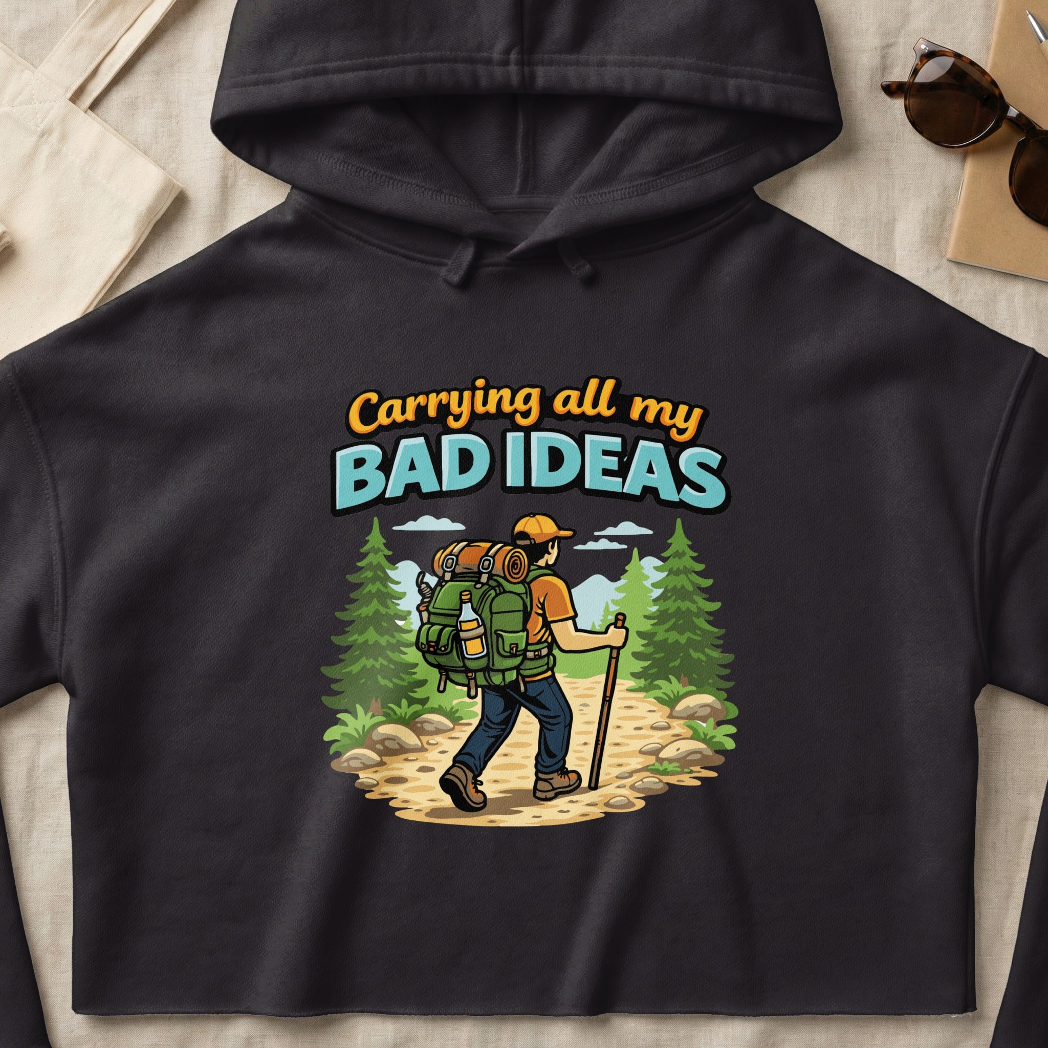 Graphic of hiker with backpack and text "Carrying all my bad ideas."