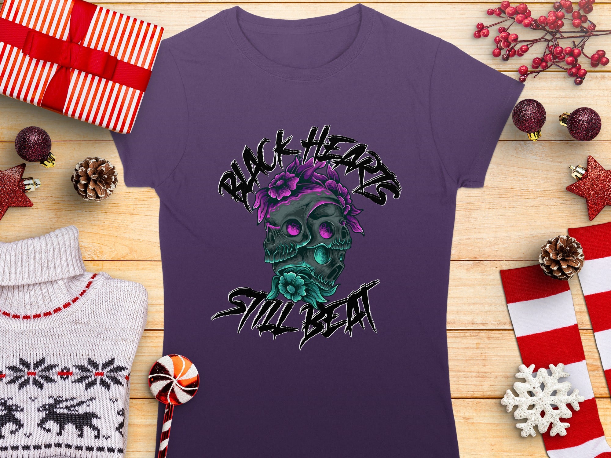 Purple t-shirt with black hearts and skulls graphic, "Black Hearts Still Beat" text.