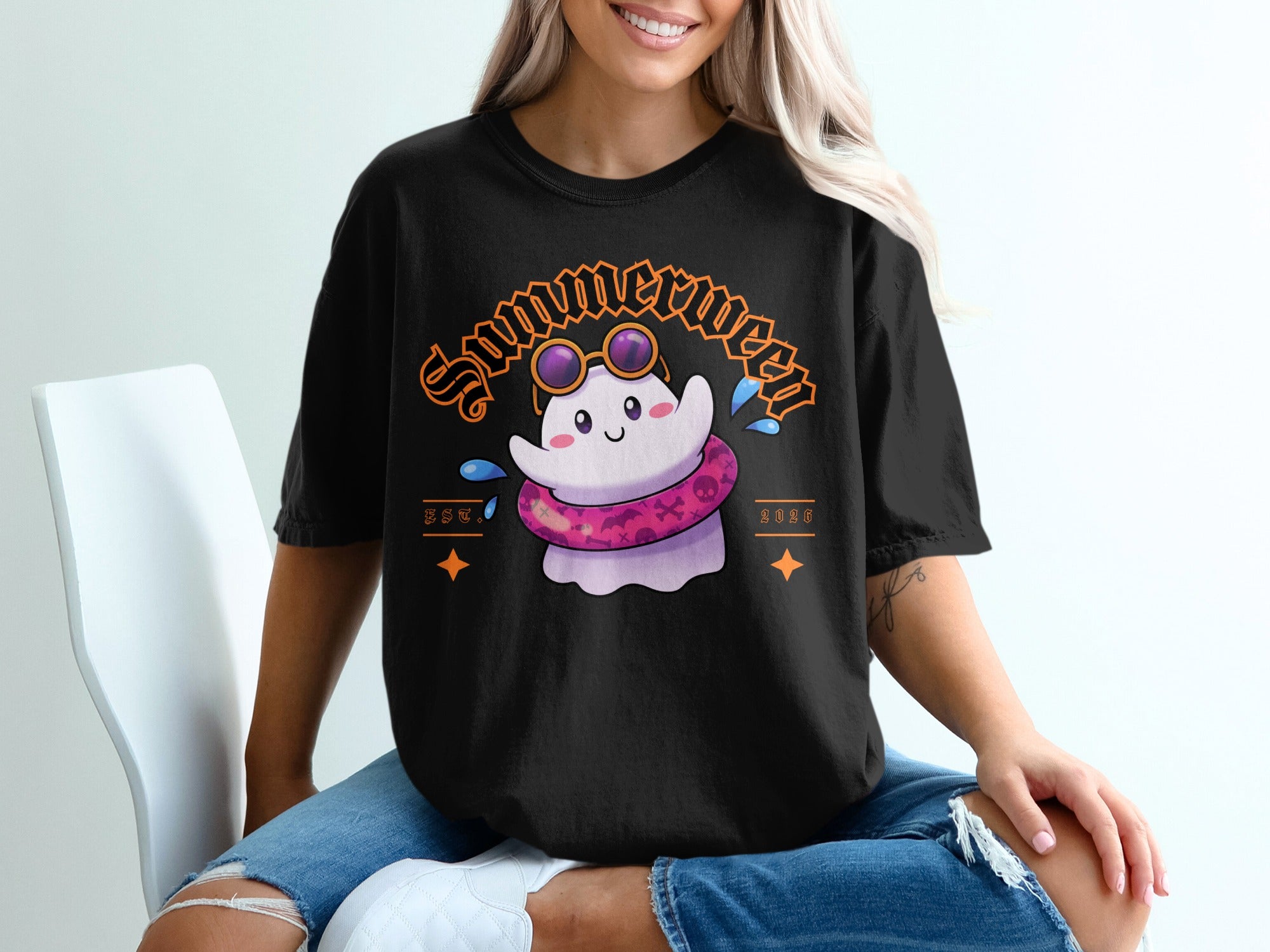 Black t-shirt with a cartoon ghost wearing sunglasses and a pink inner tube.