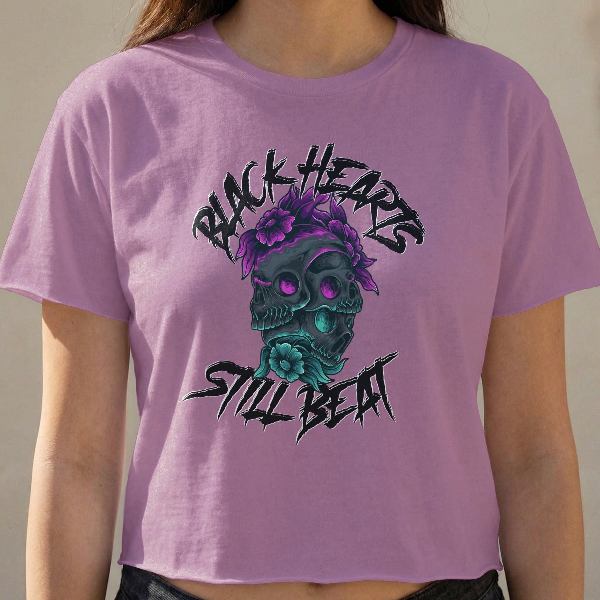 Purple cropped t-shirt with a skull graphic and "BLACK HEARTS STILL BEAT" text.
