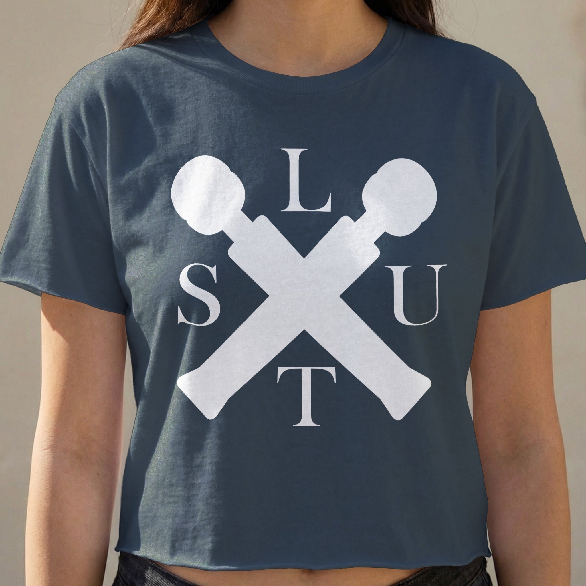 Dark blue crop top with white "SLUT" lettering and crossed microphones.