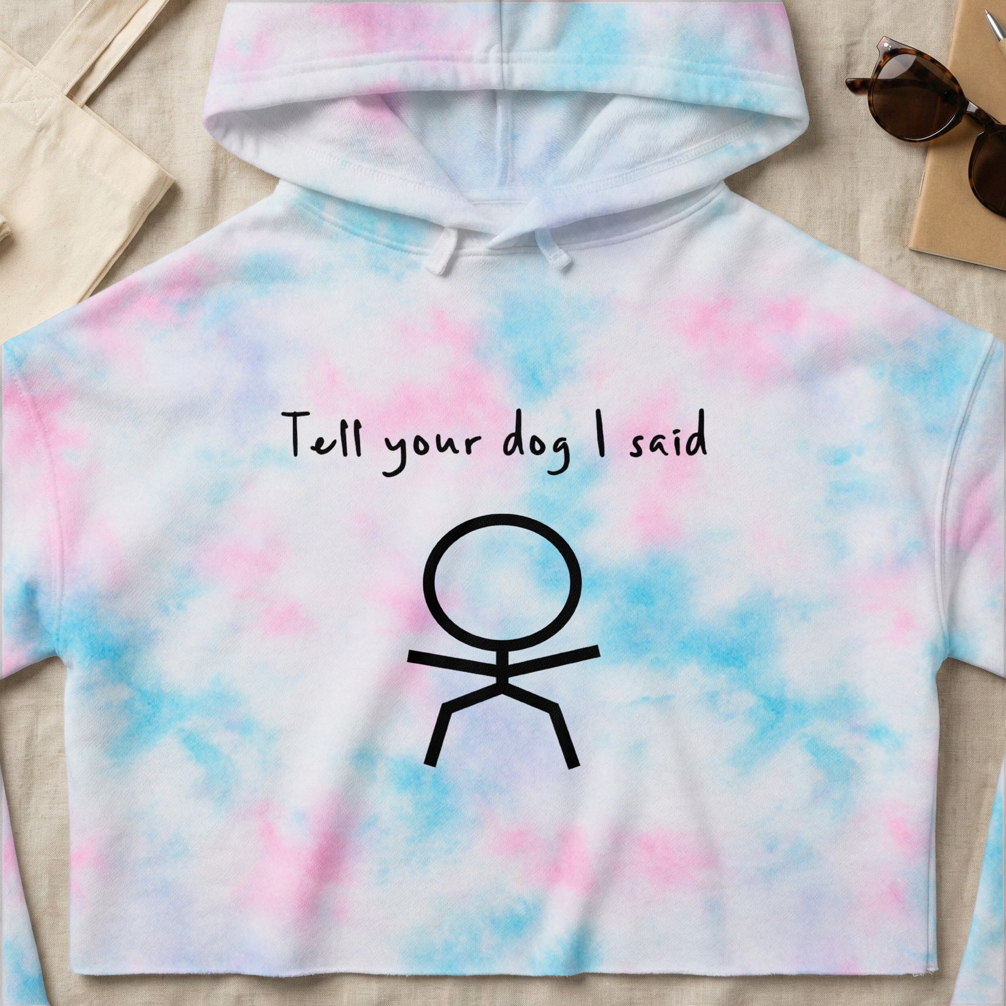 Cropped tie-dye hoodie with stick figure and "Tell your dog I said" text.
