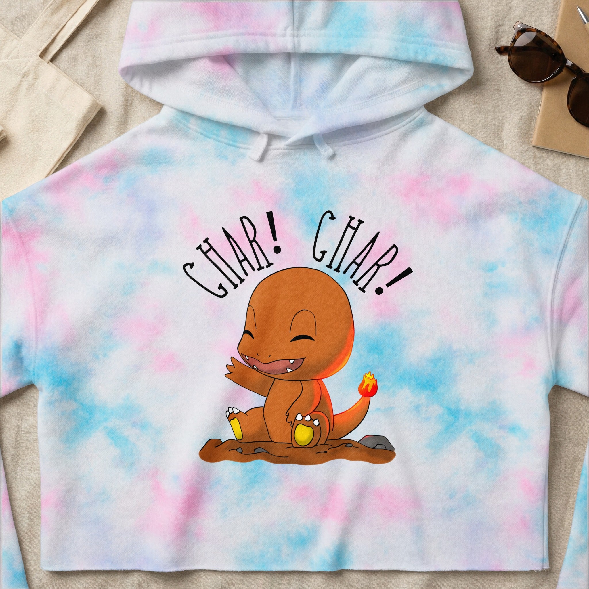 Charmander graphic on a cropped tie-dye hoodie with "CHAR! CHAR!" text.