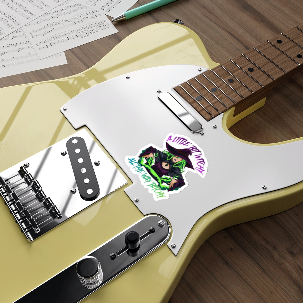 Sticker on electric guitar reads "A Little Bit Witchy All The Way Bitchy".