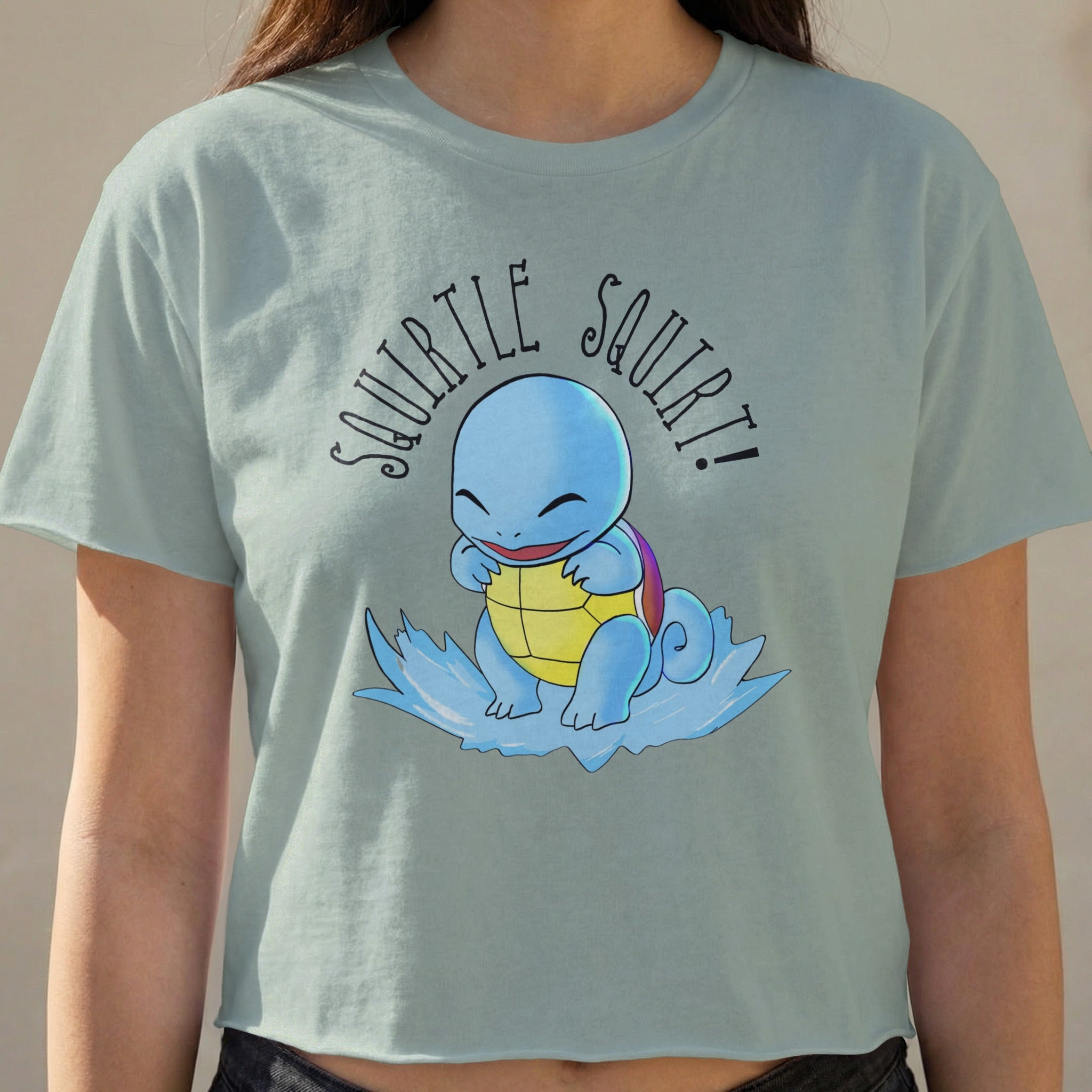 Squirtle from Pokémon on a light blue t-shirt with "Squirtle Squirt!" text.