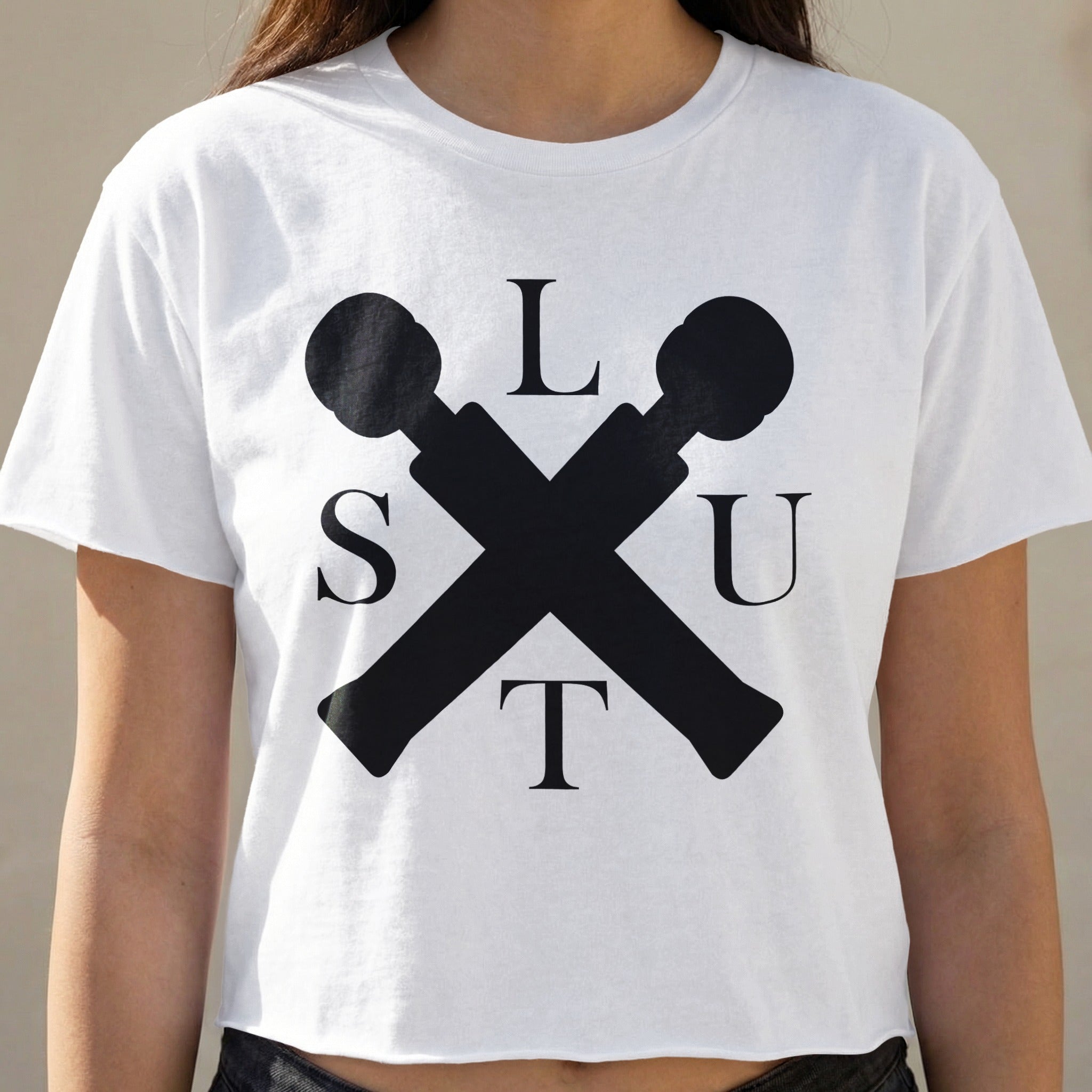 White t-shirt with black "SLUT" lettering and crossed microphones.