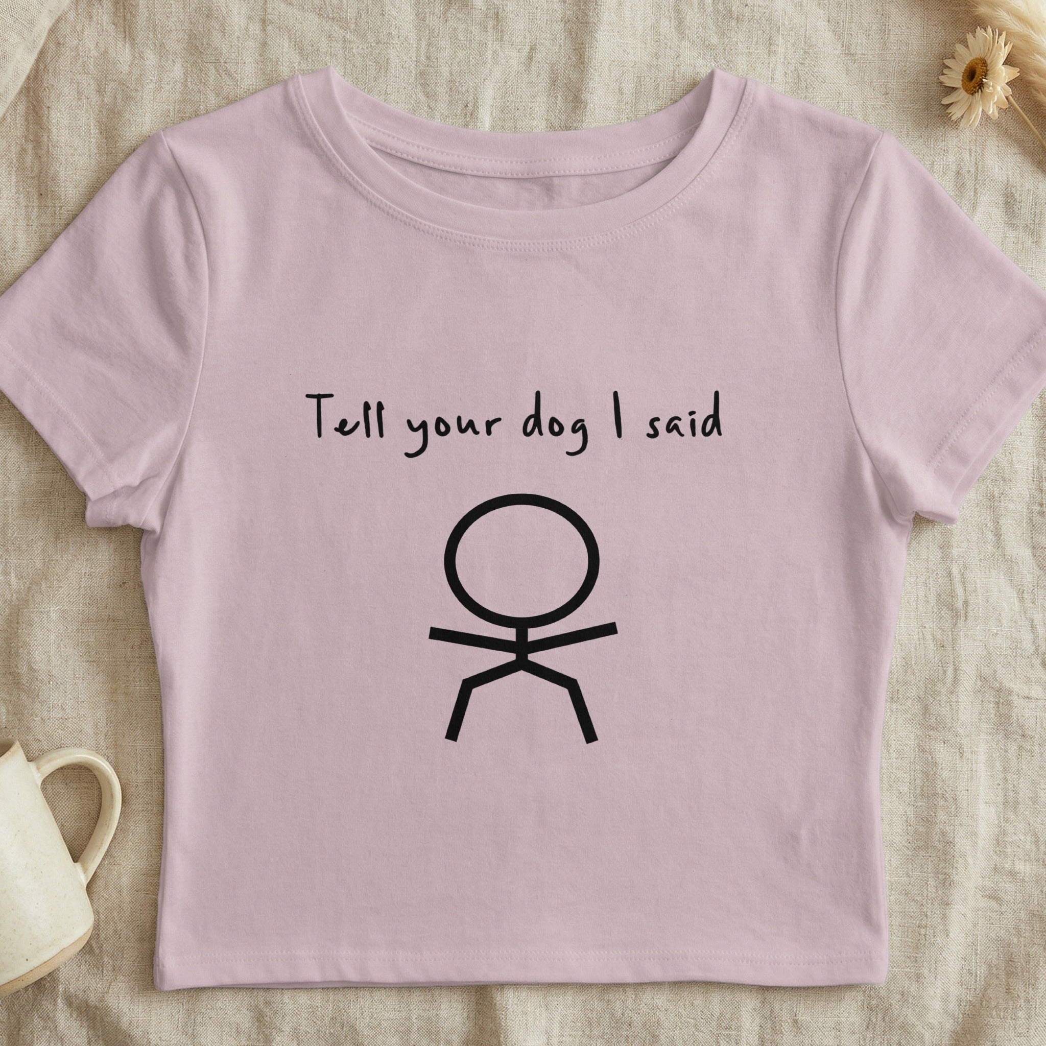 Pink crop top with "Tell your dog I said" and a stick figure.