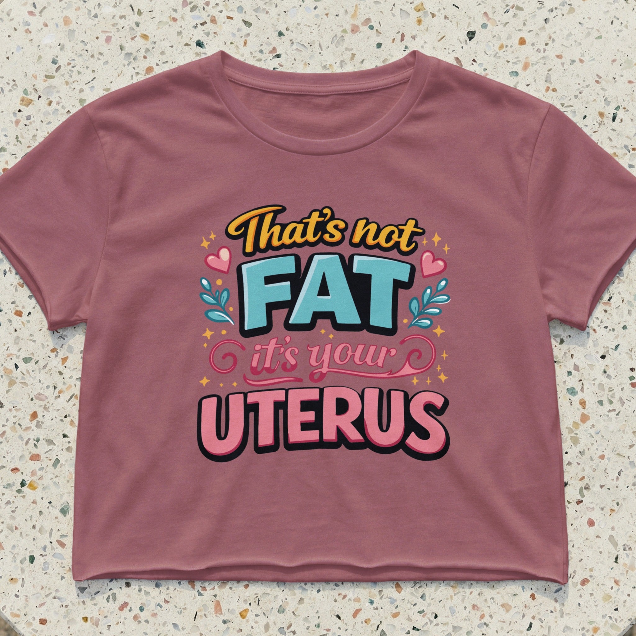 Crop top with "That's not FAT it's your UTERUS" text and colorful graphics.