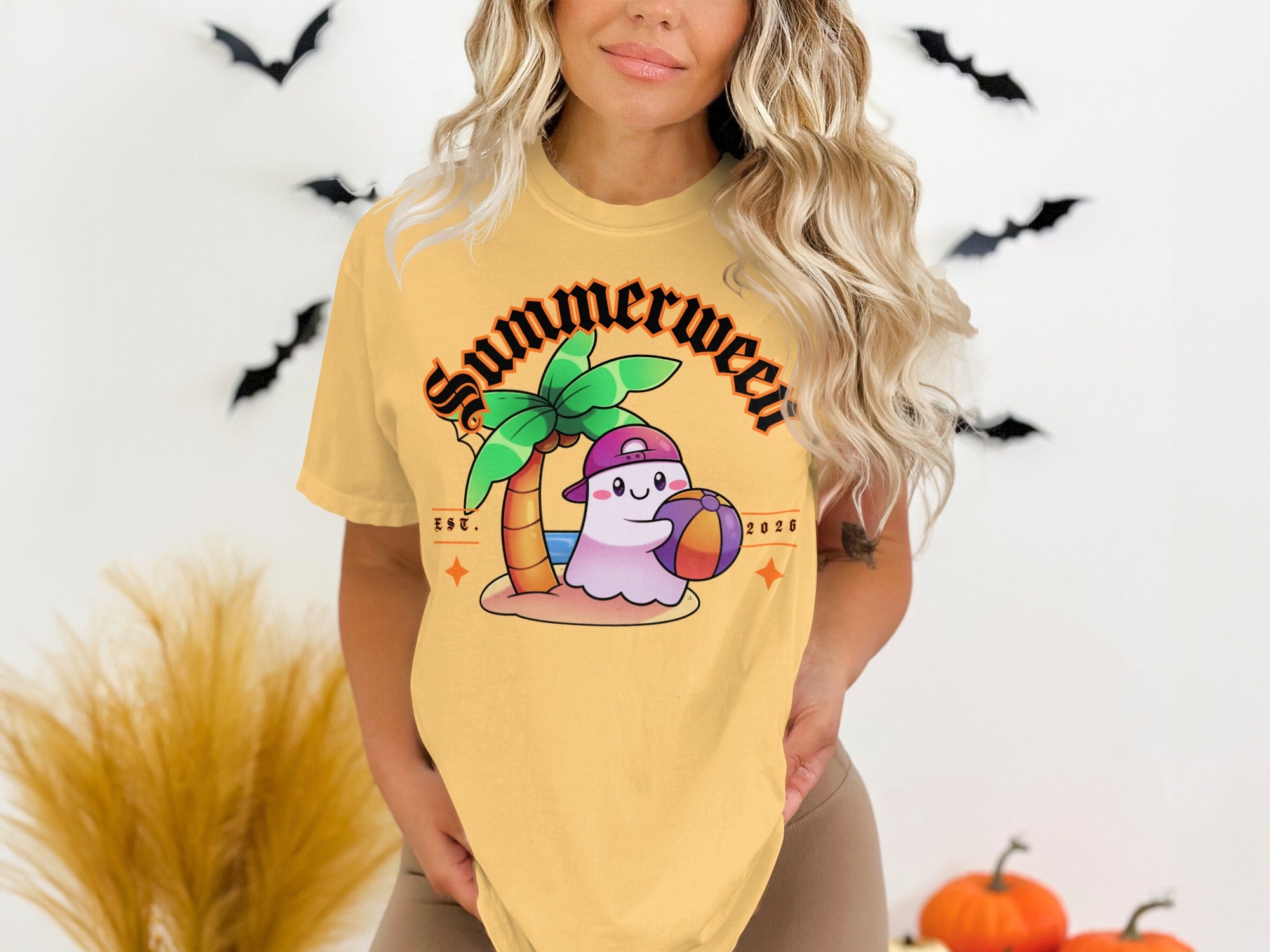 Yellow t-shirt with "Summerween Est. 2026" text and a ghost holding a beach ball.
