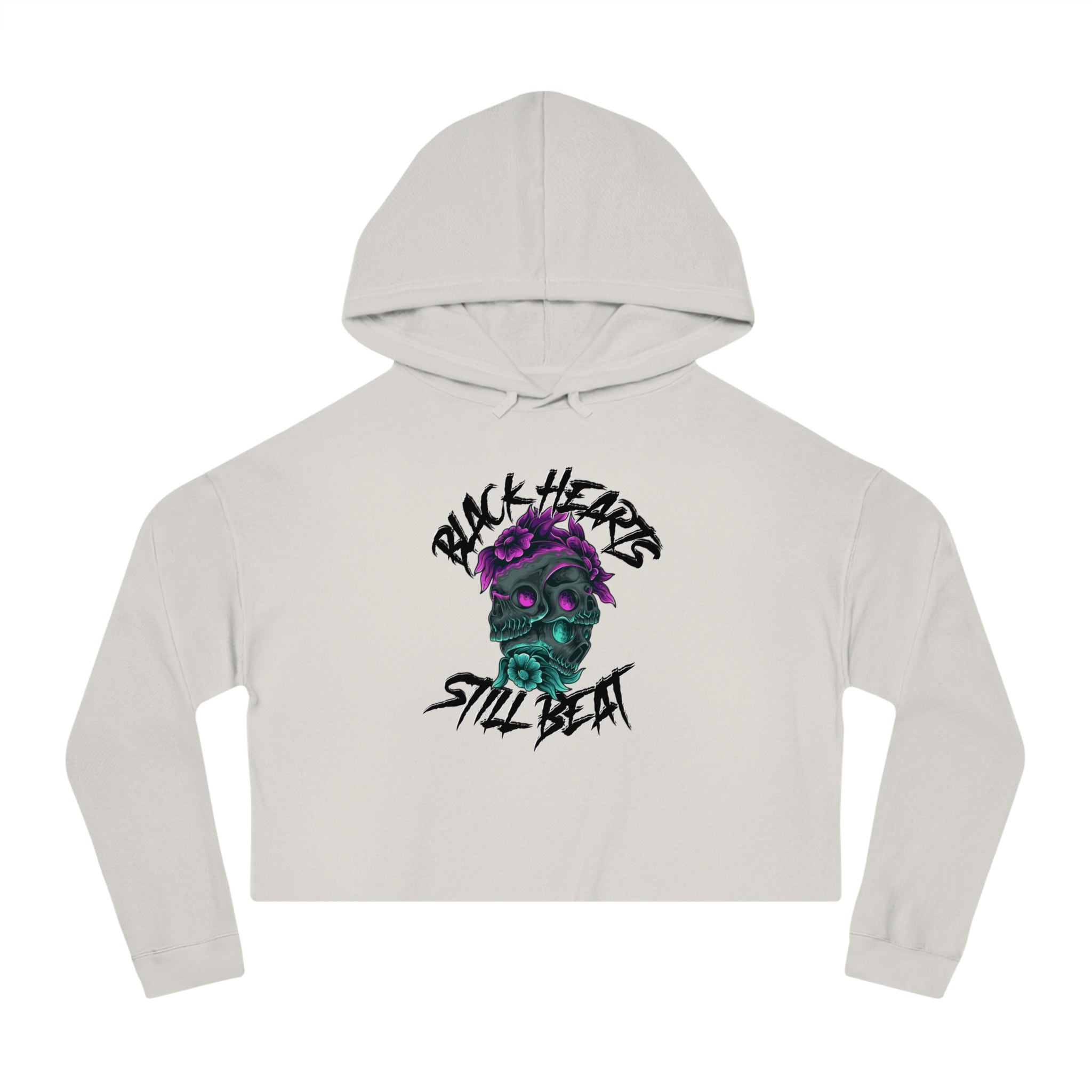 White cropped hoodie with Black Hearts Still Beat skull graphic.
