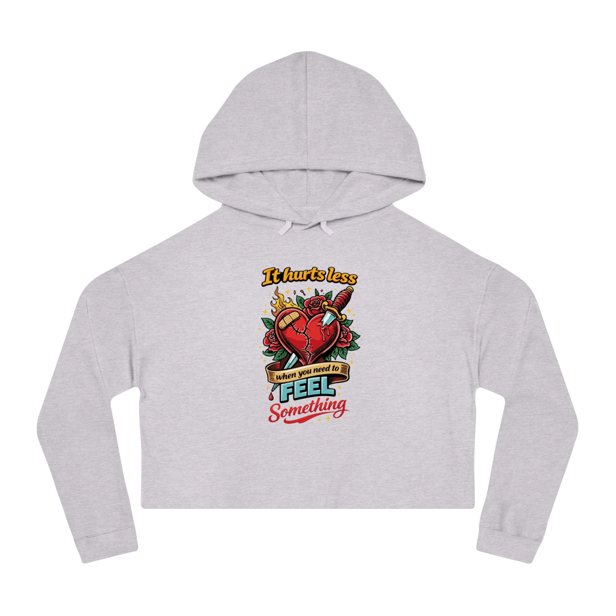 Grey cropped hoodie with graphic of a heart pierced by a knife, text "It hurts less when you need to FEEL SOMETHING".