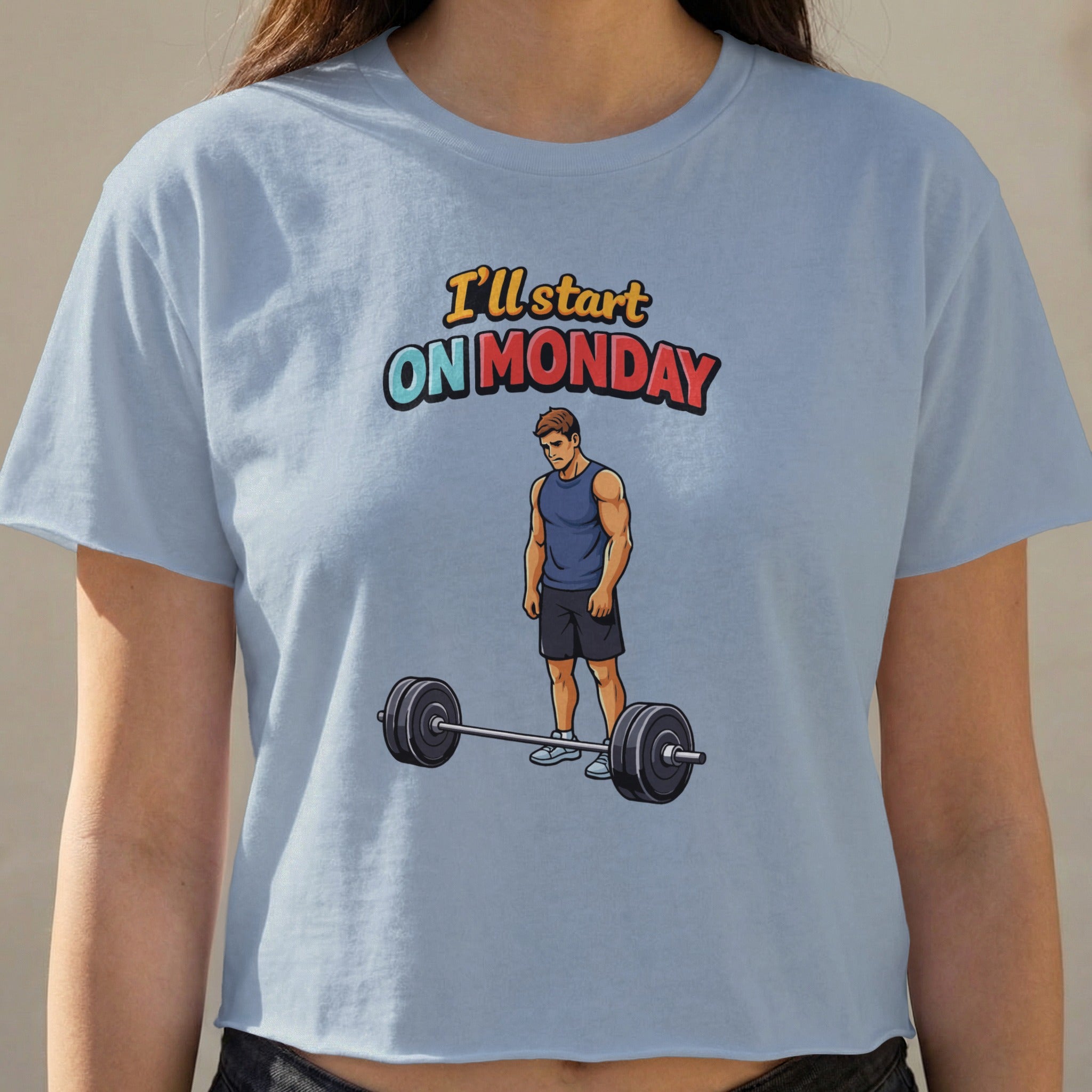 T-shirt with cartoon man looking at barbell, text "I'll start ON MONDAY".