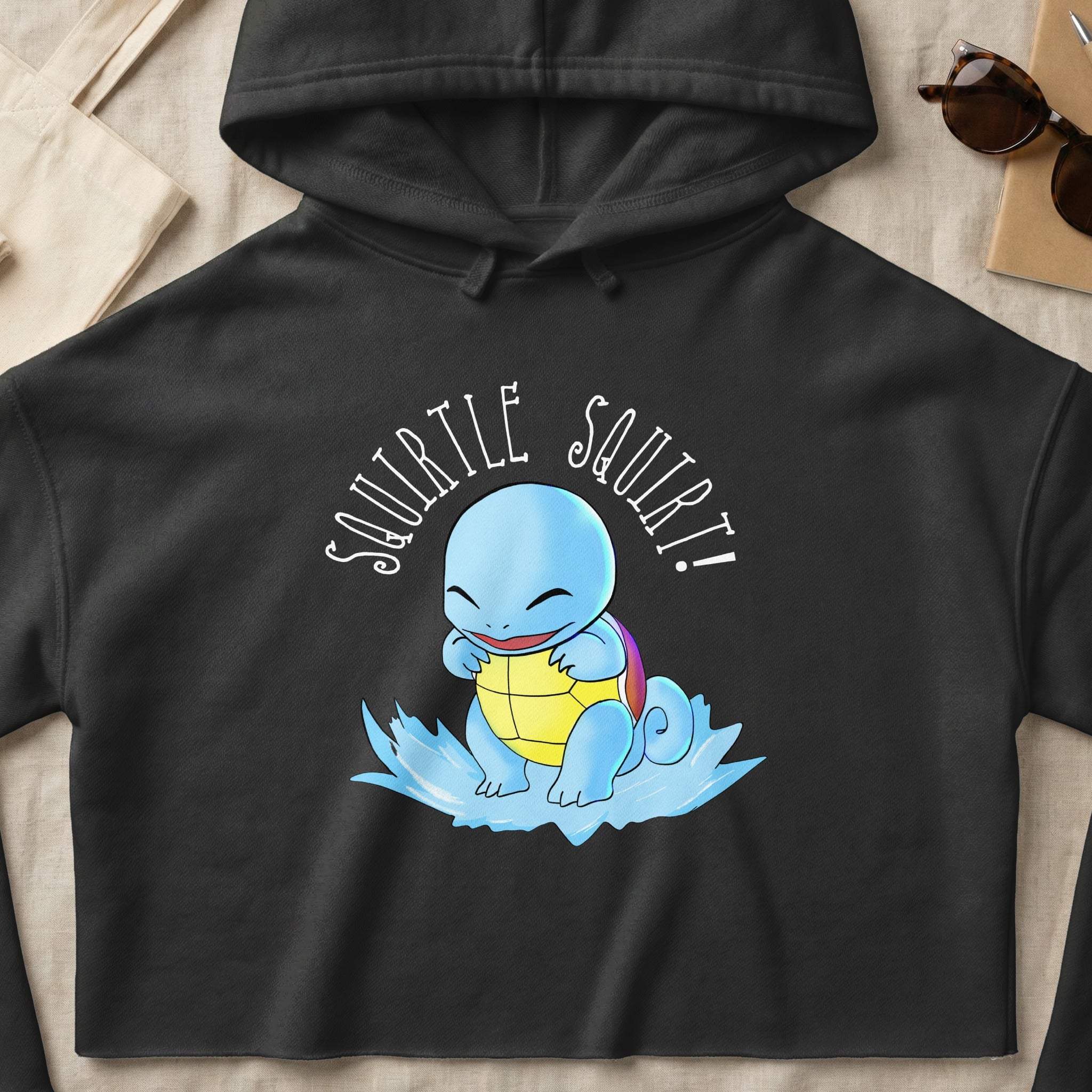 Black hoodie featuring a cartoon Squirtle with "Squirtle Squirt!" text.