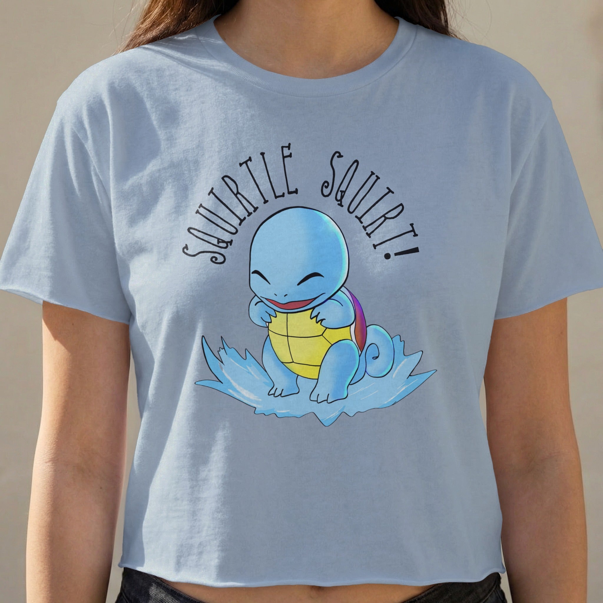 Light blue crop top with Squirtle and "Squirtle Squirt!" text.