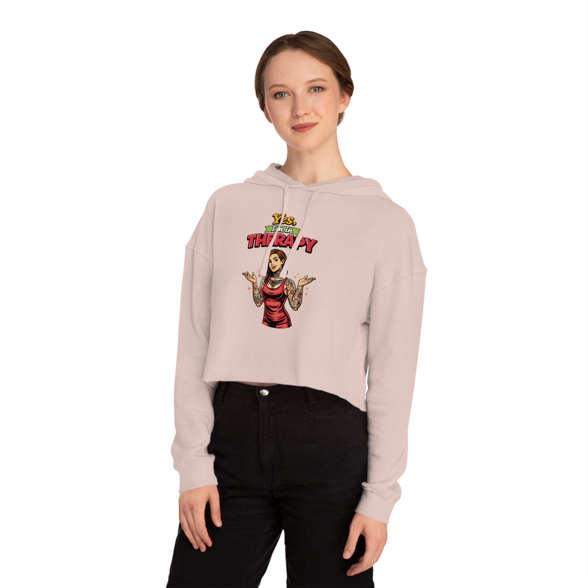 Woman in cropped hoodie with "Let's Get Therapy" graphic and tattoos.