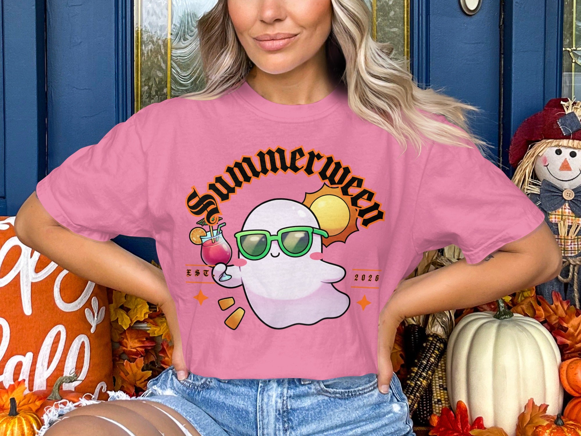 Pink t-shirt with a ghost in sunglasses holding a drink, "Summerween EST 2026" text.