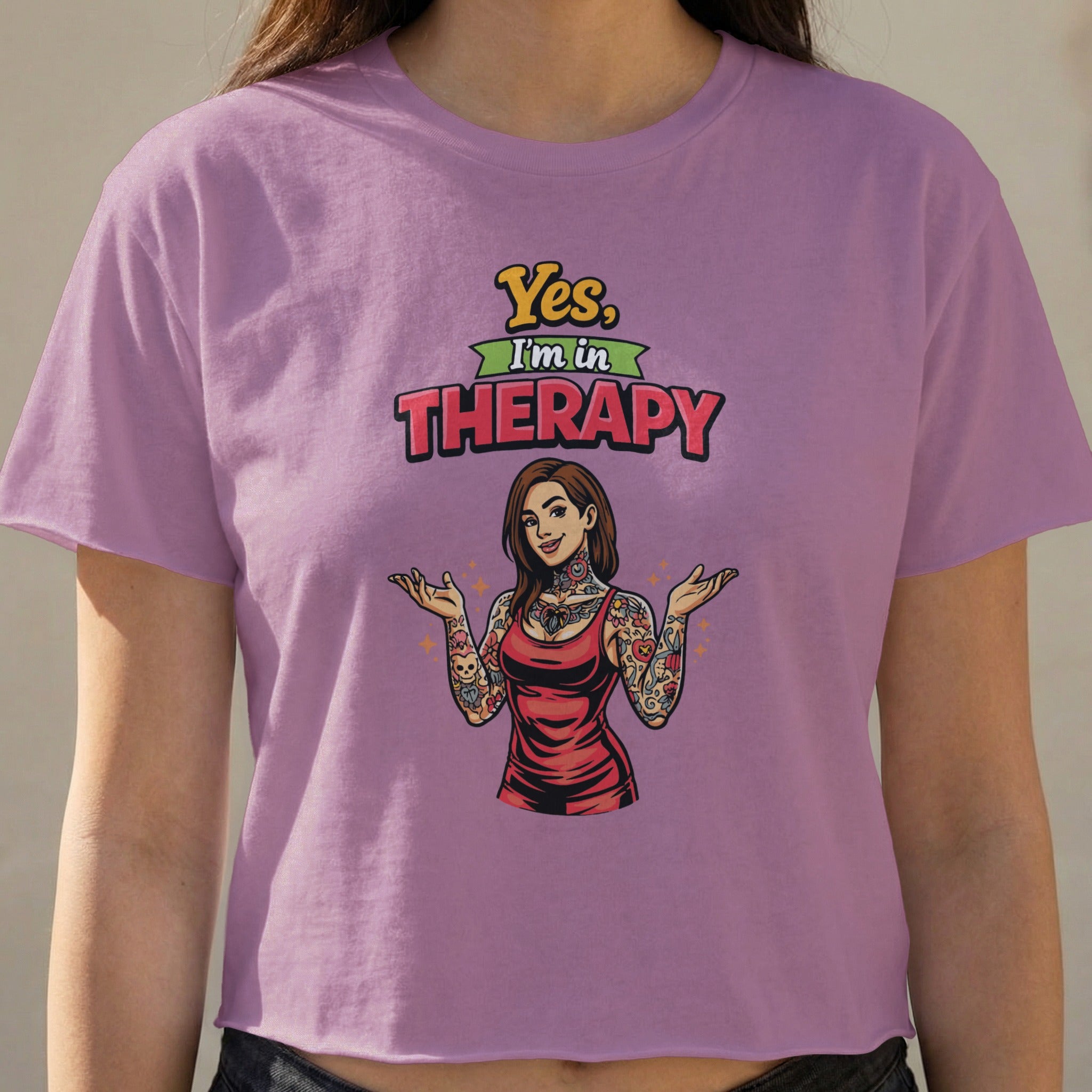 Purple crop top with "Yes, I'm in Therapy" text and tattooed woman graphic.