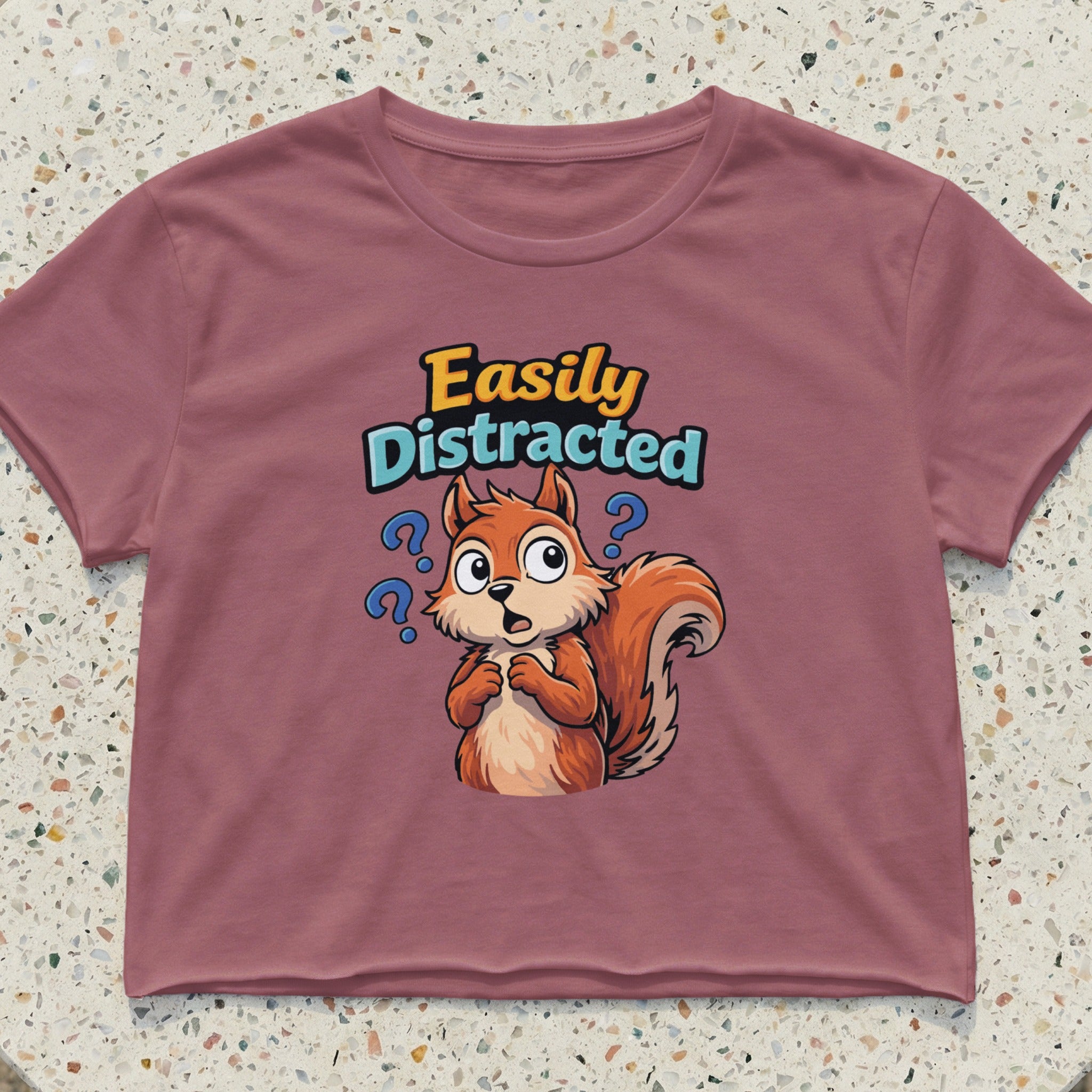 T-shirt with cartoon squirrel and "Easily Distracted" text.