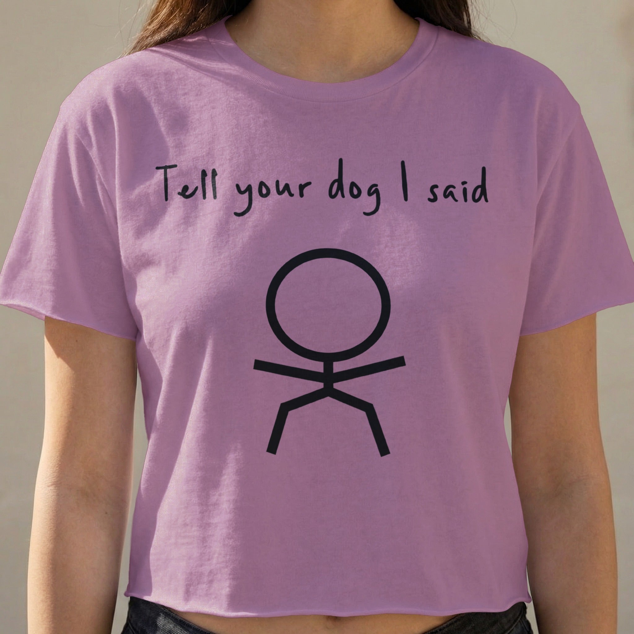 Lilac crop top with "Tell your dog I said" and a stick figure.