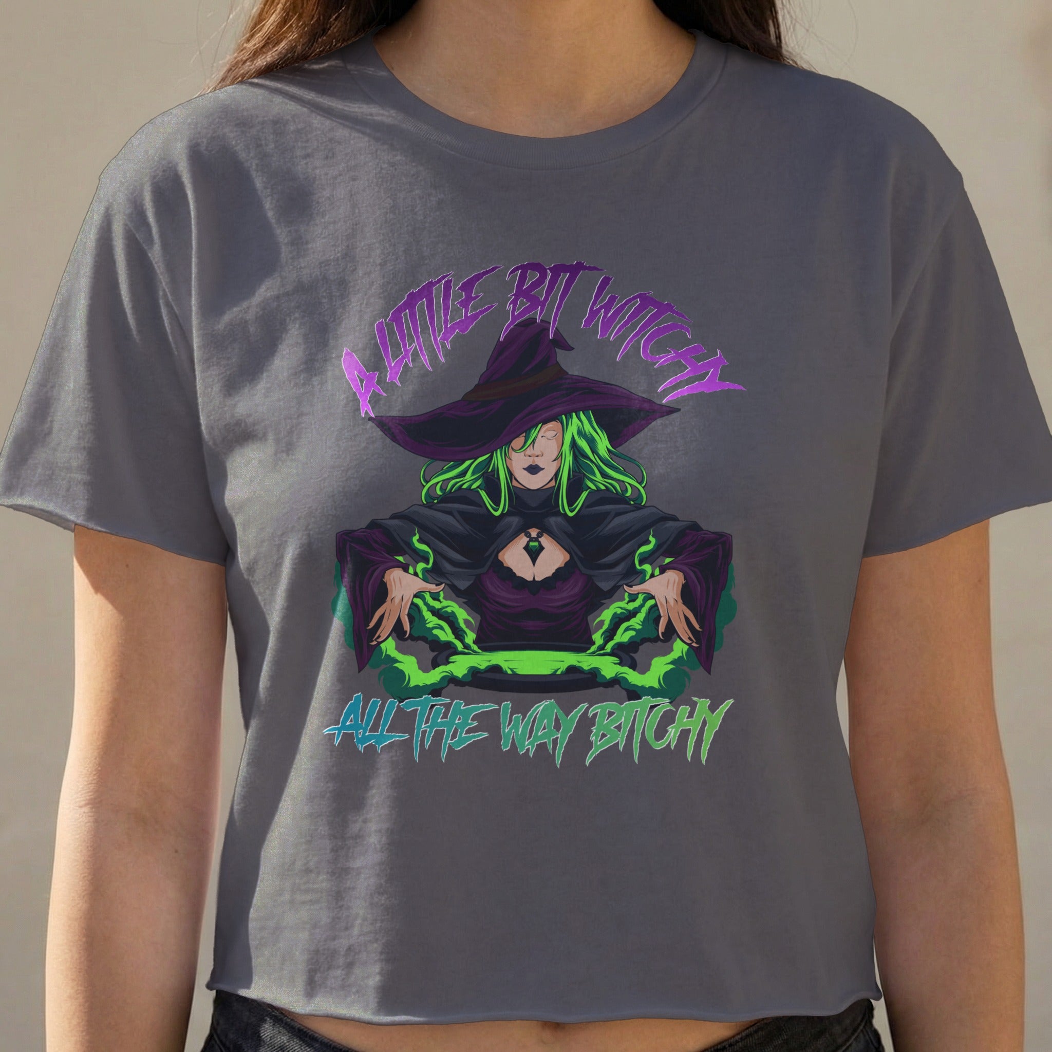 Gray cropped t-shirt with a witch graphic and text "A Little Bit Witch All The Way Bitchy".