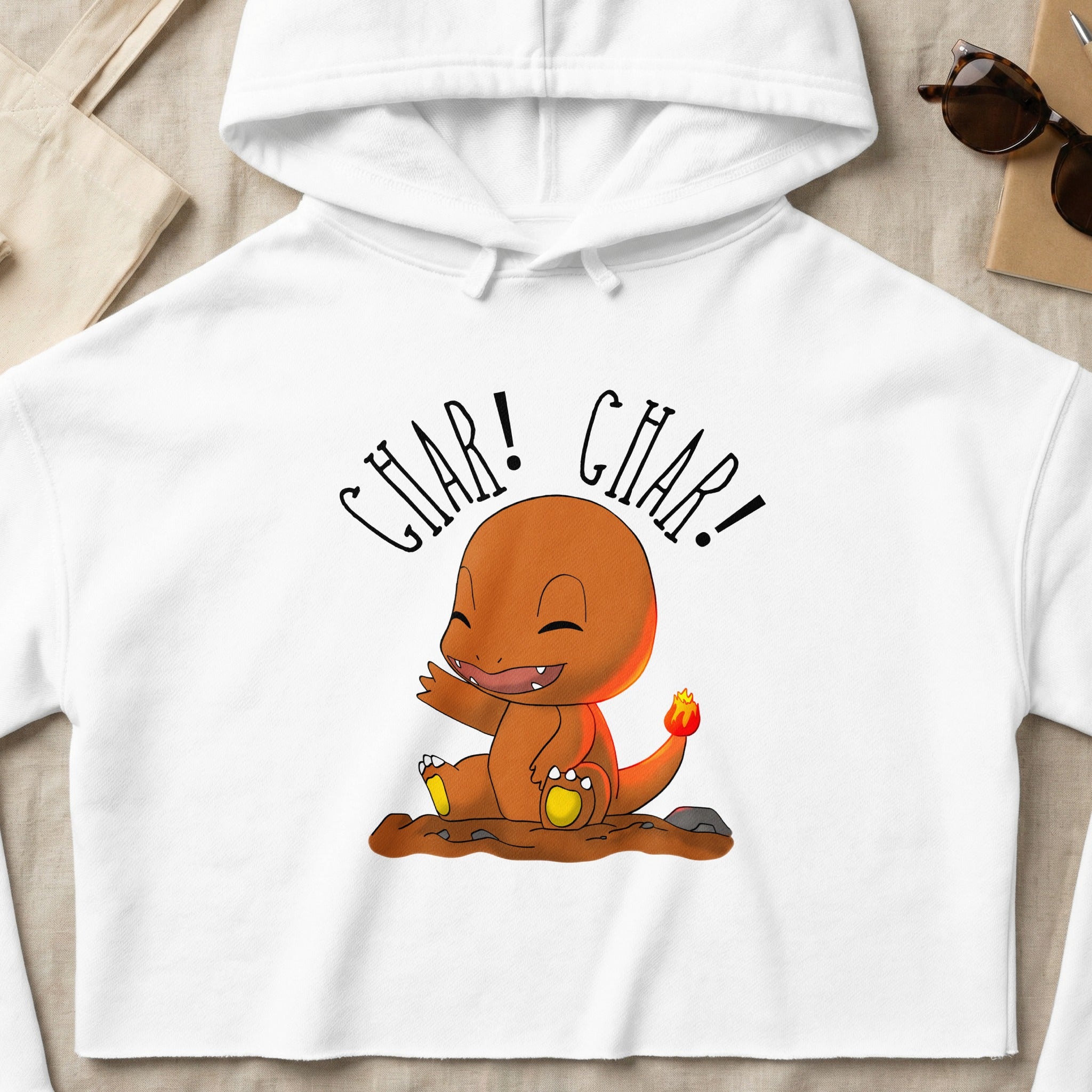 White cropped hoodie with a cartoon Charmander character.