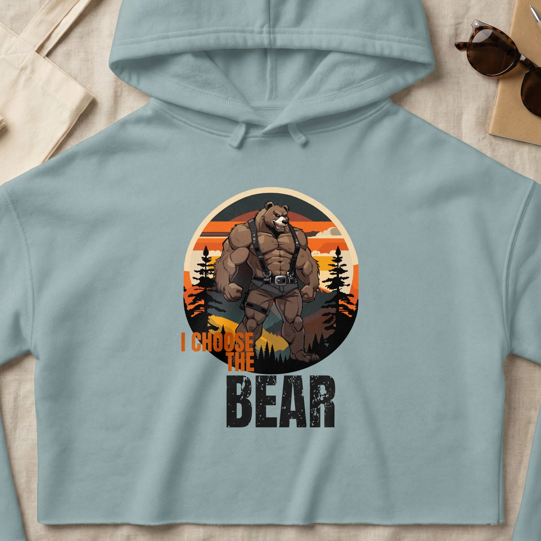 Light blue hoodie with graphic of muscular bear and text "I CHOOSE THE BEAR".