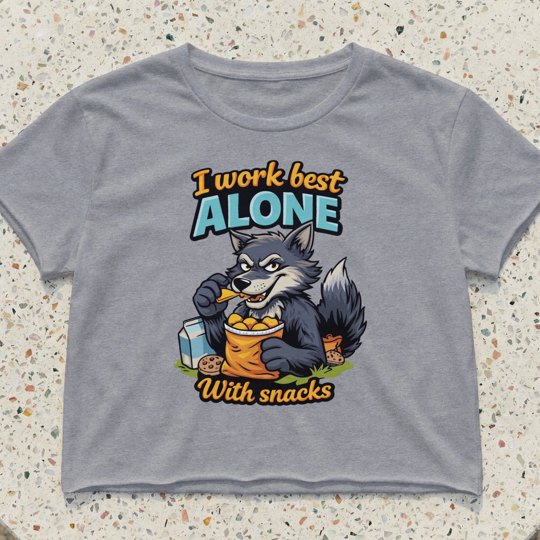 Gray crop top with wolf graphic and text "I work best alone with snacks".