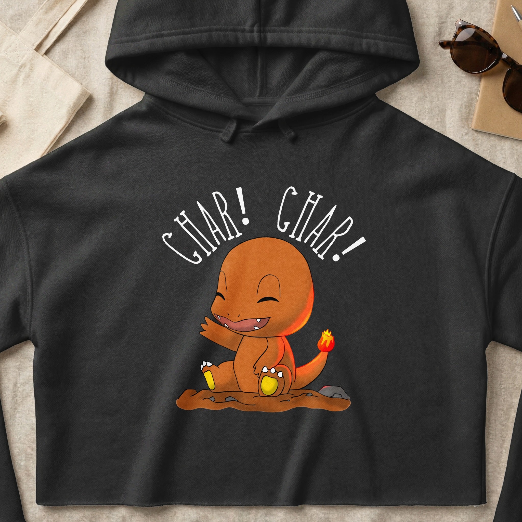 Charmander character on a black hoodie with "Char! Char!" text.