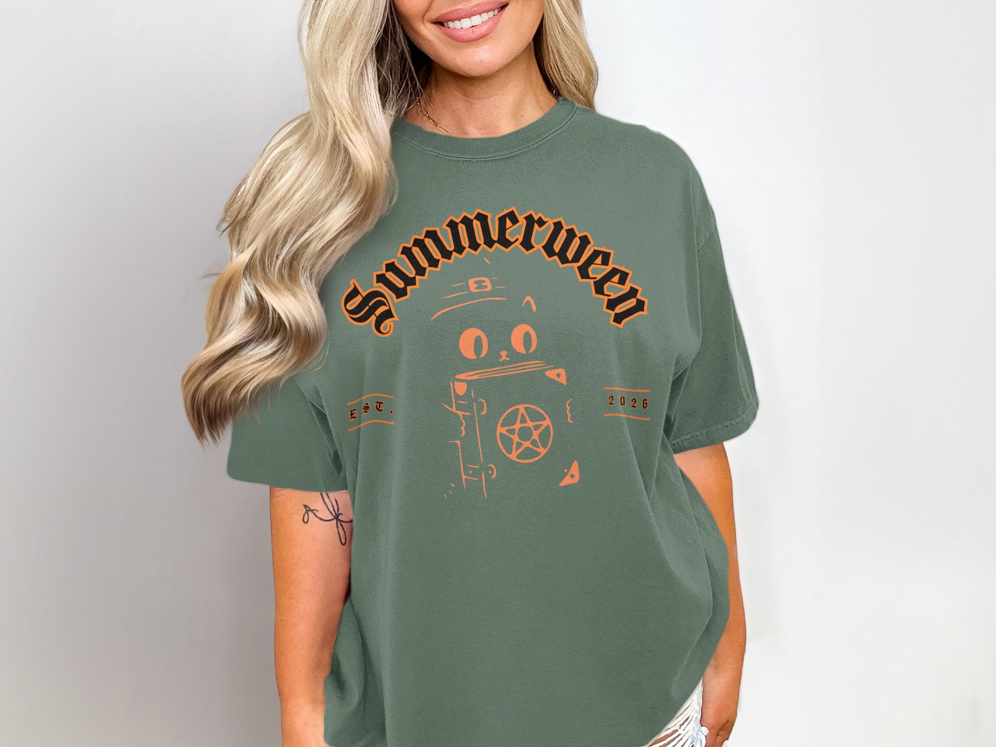 Green t-shirt with orange "Summerween" text, cat, and pentagram graphic.