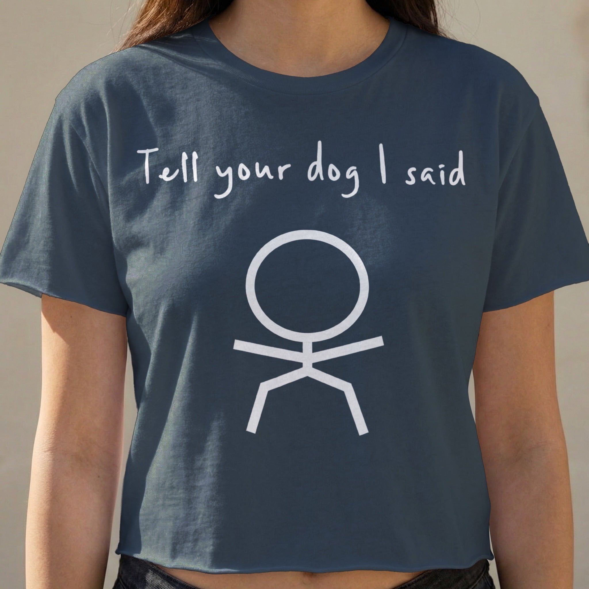 Dark blue cropped t-shirt with "Tell your dog I said" and a stick figure.