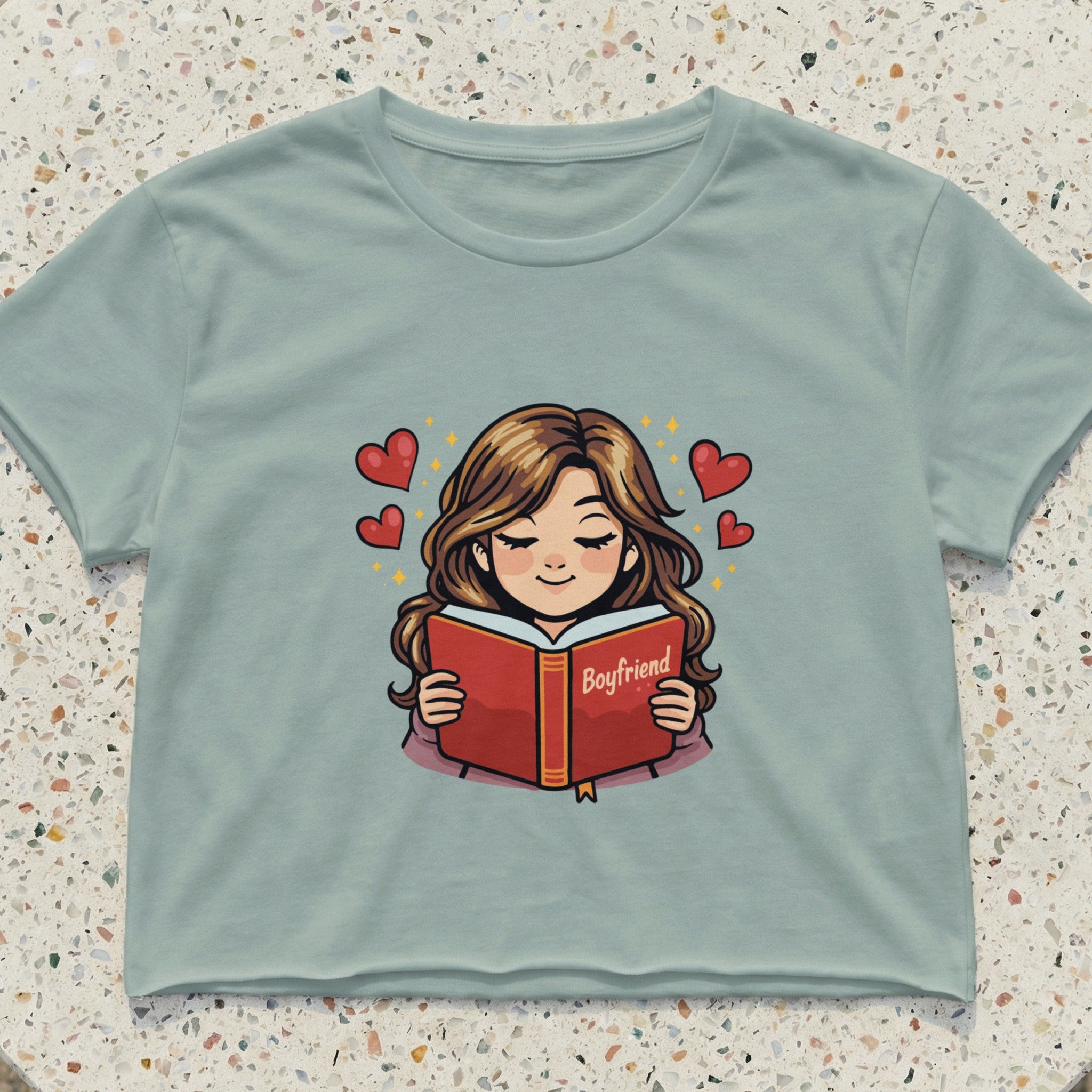 Girl reading a book titled "Boyfriend" with hearts floating around her.
