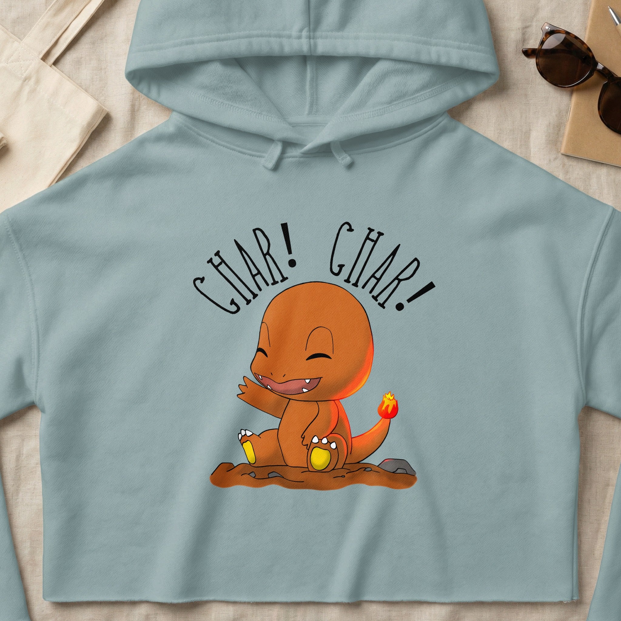 Charmander cartoon character sitting and waving with "CHAR! CHAR!" text.