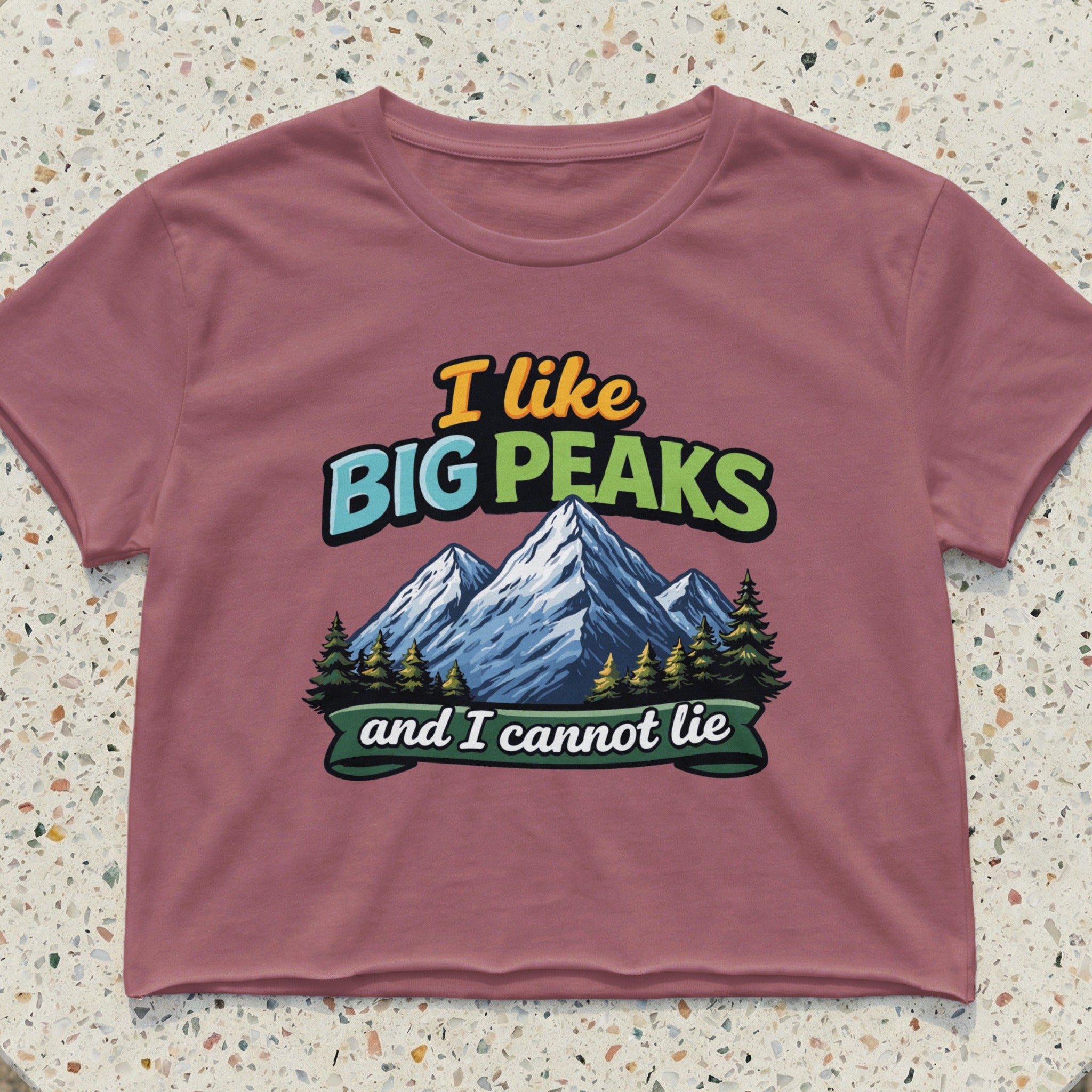 T-shirt with "I like Big Peaks and I cannot lie" text and mountain graphic.