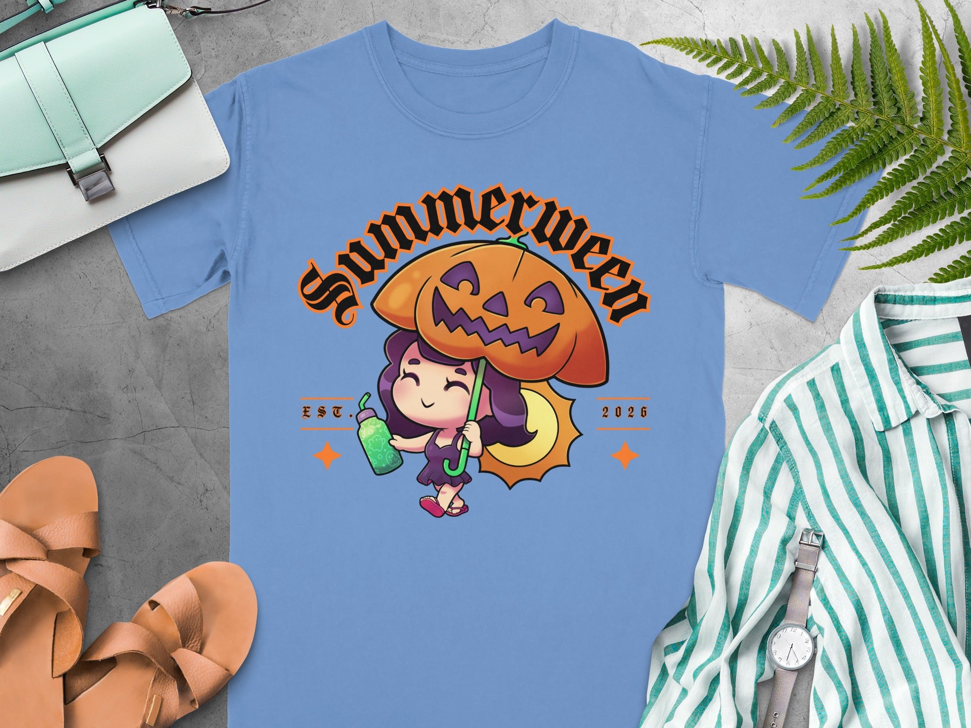 Light blue t-shirt with "Summerween" graphic featuring a girl, pumpkin, and umbrella.