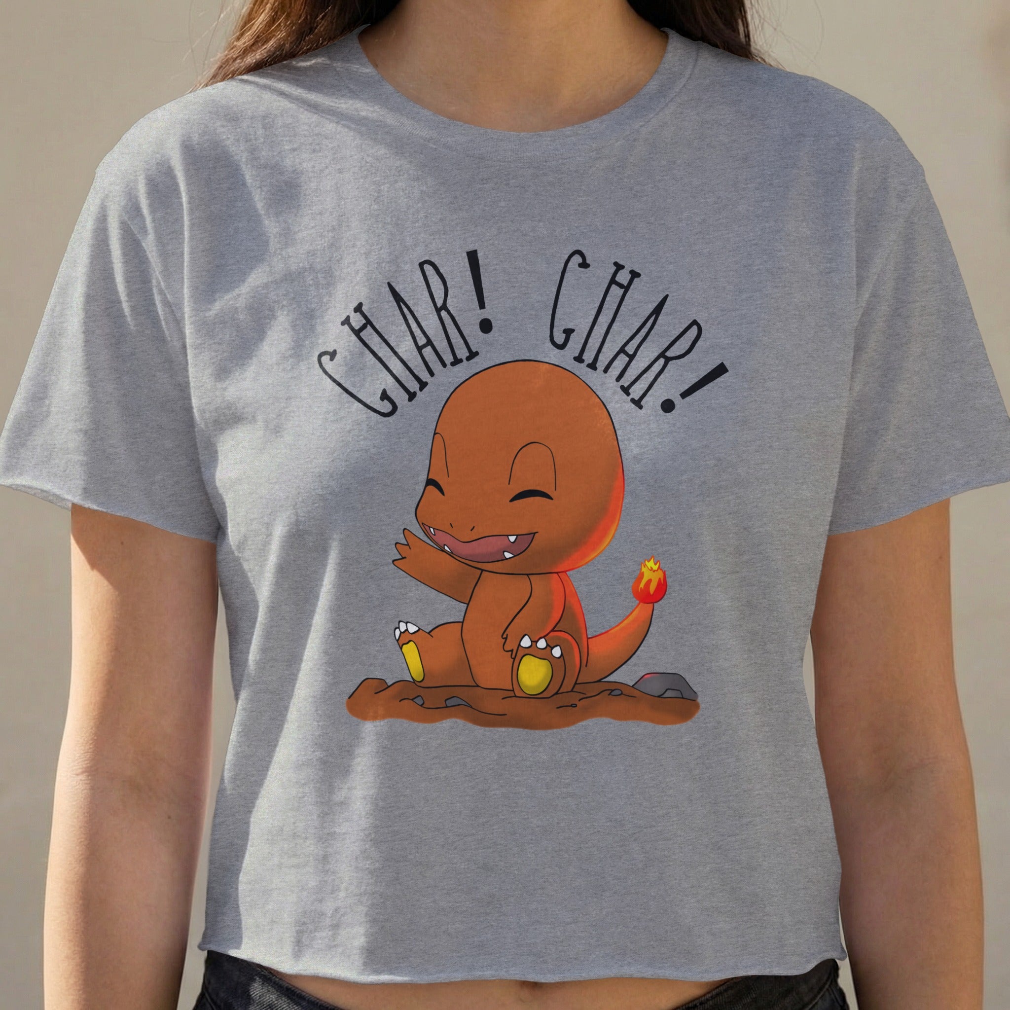 Charmander character on gray cropped t-shirt with "CHAR! CHAR!" text.