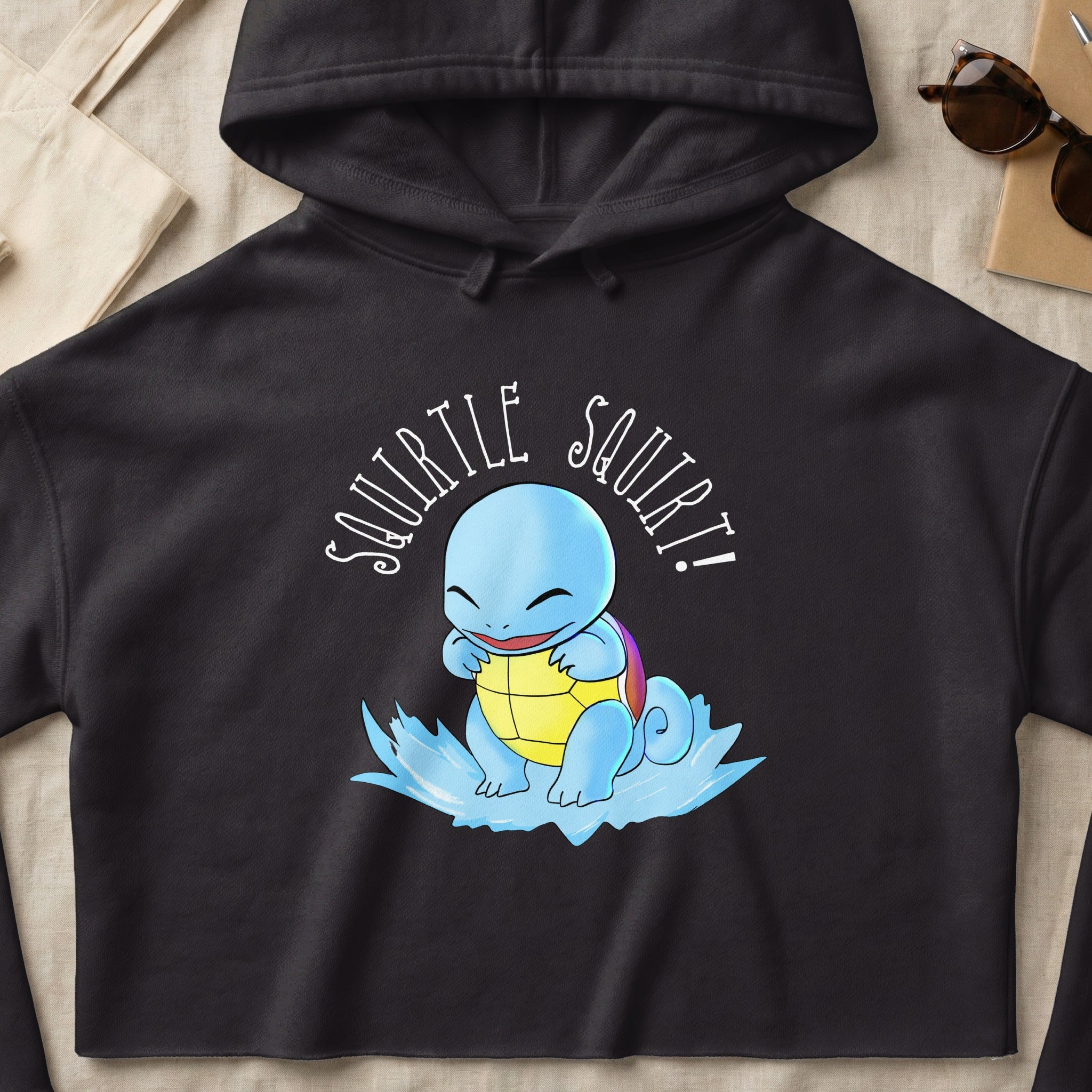 Black hoodie with Squirtle from Pokémon splashing water.