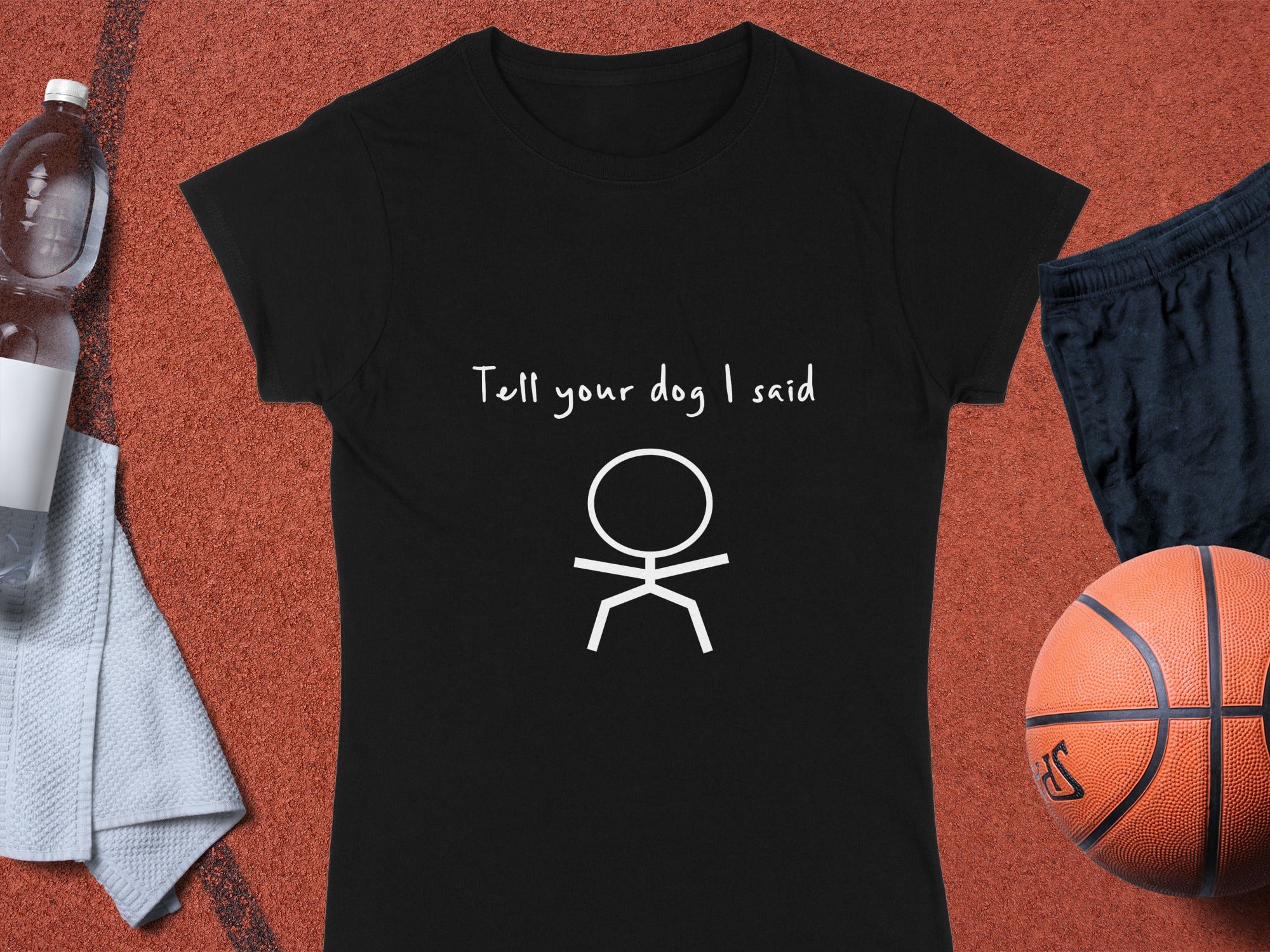 Black t-shirt with "Tell your dog I said" and a stick figure.
