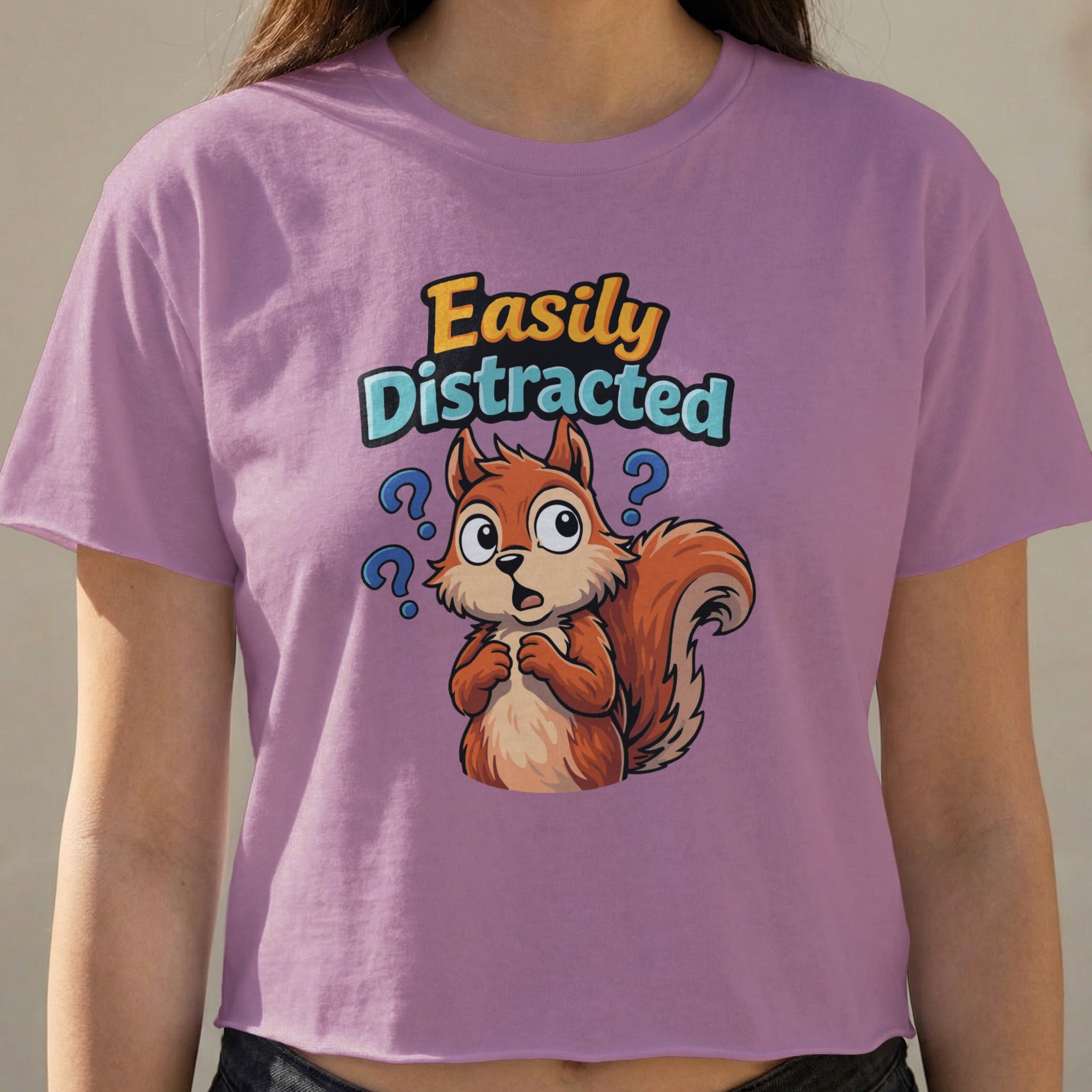 Squirrel with question marks above head, text "Easily Distracted"