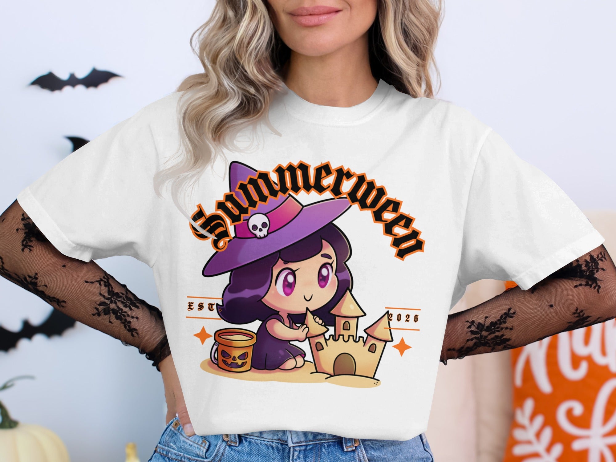 "Summerween" text graphic with cartoon witch building sandcastle and Halloween bucket.