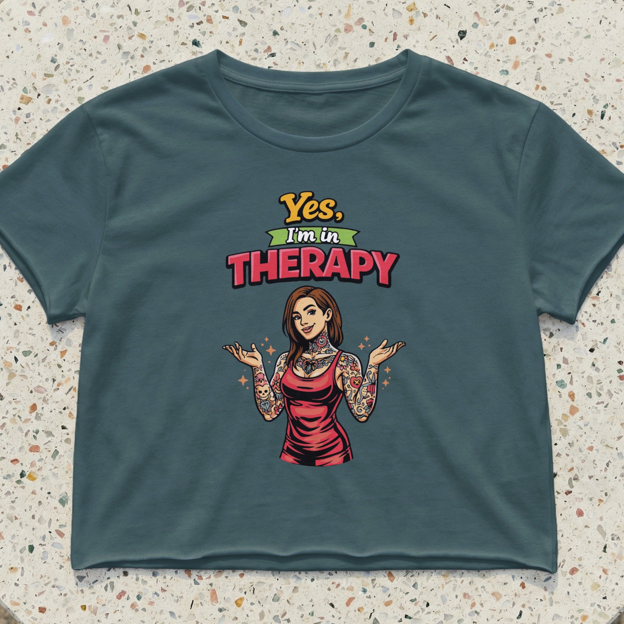 Graphic crop top with "Yes, I'm in THERAPY" text and tattooed woman.