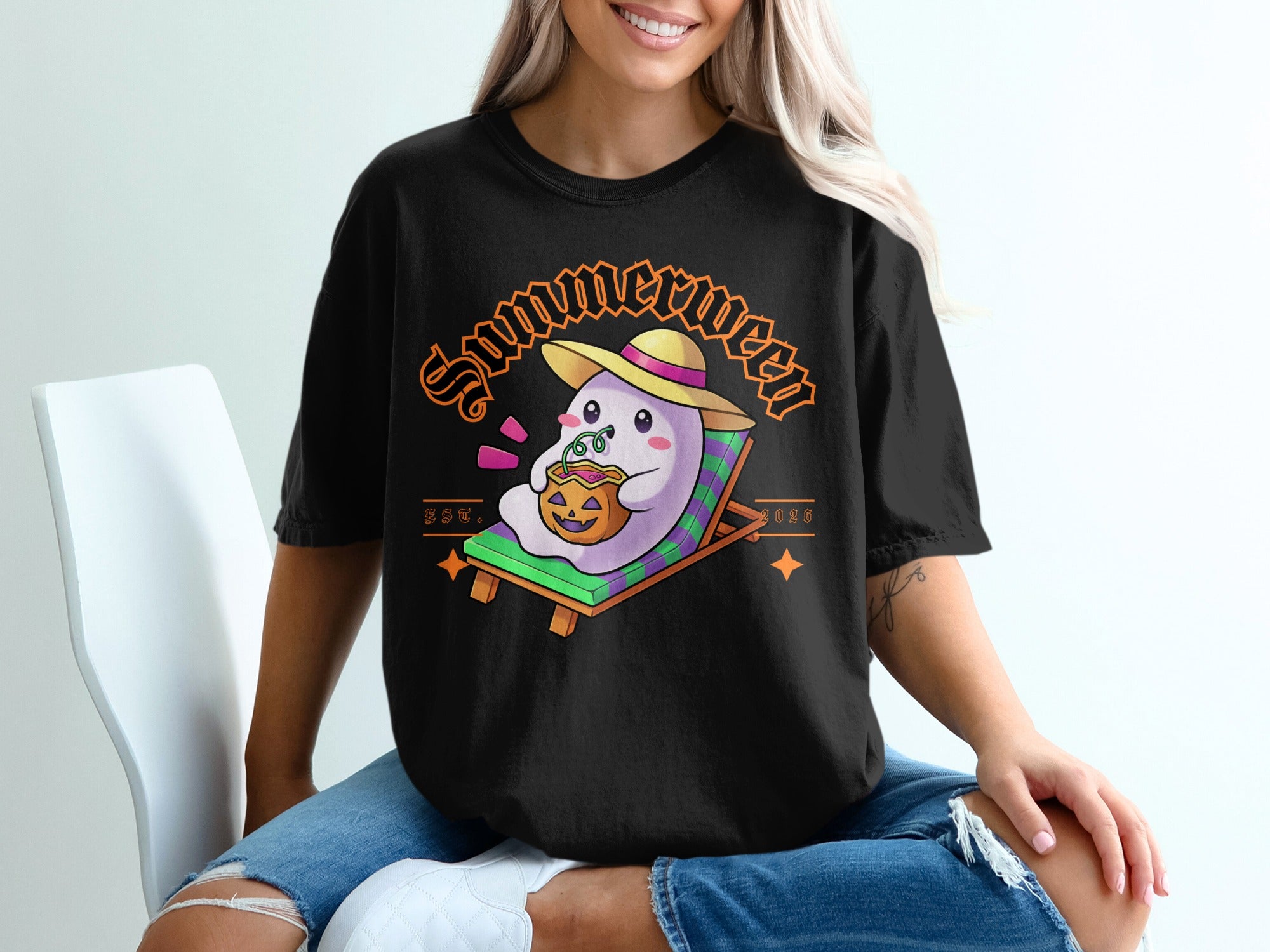 Black t-shirt with a ghost wearing a straw hat holding a pumpkin drink.
