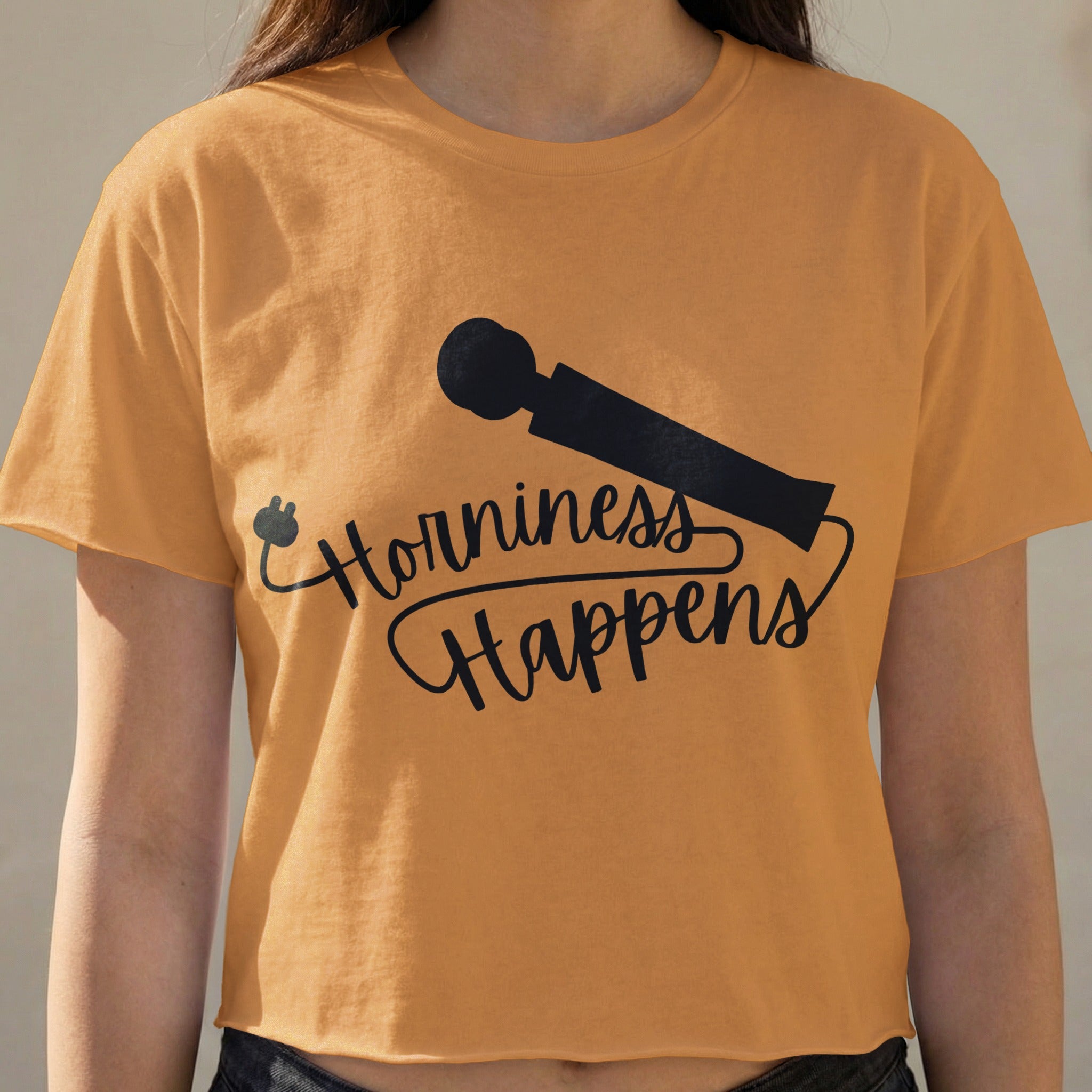 Orange crop top with "Horniness Happens" text and a microphone graphic.